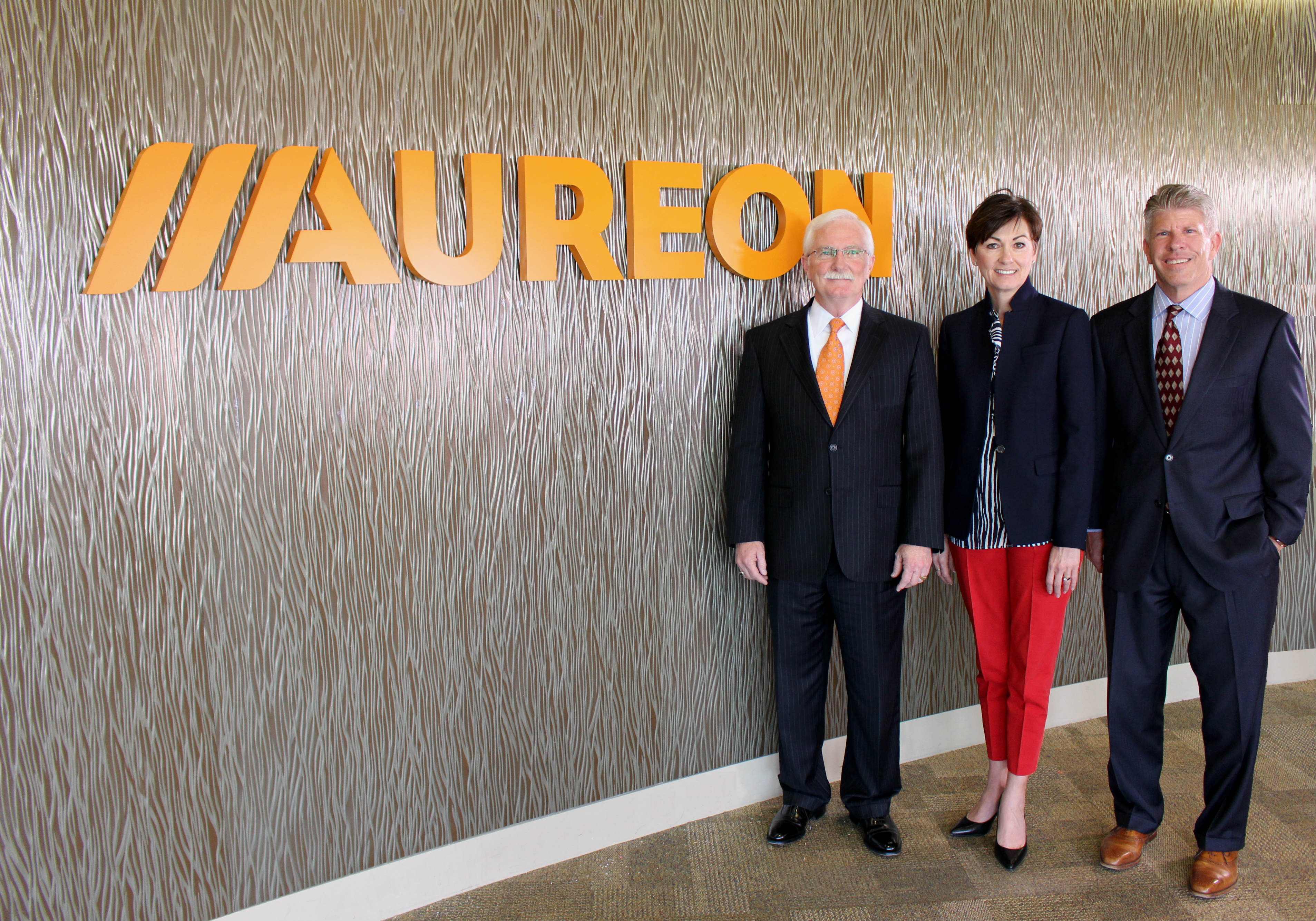 Aureon CEO Ron Keller, Iowa Lt. Gov. Kim Reynolds and West Des Moines Chamber of Commerce President Dave Schwartz unveiled the company's new logo at a launch event Tuesday, March 29.