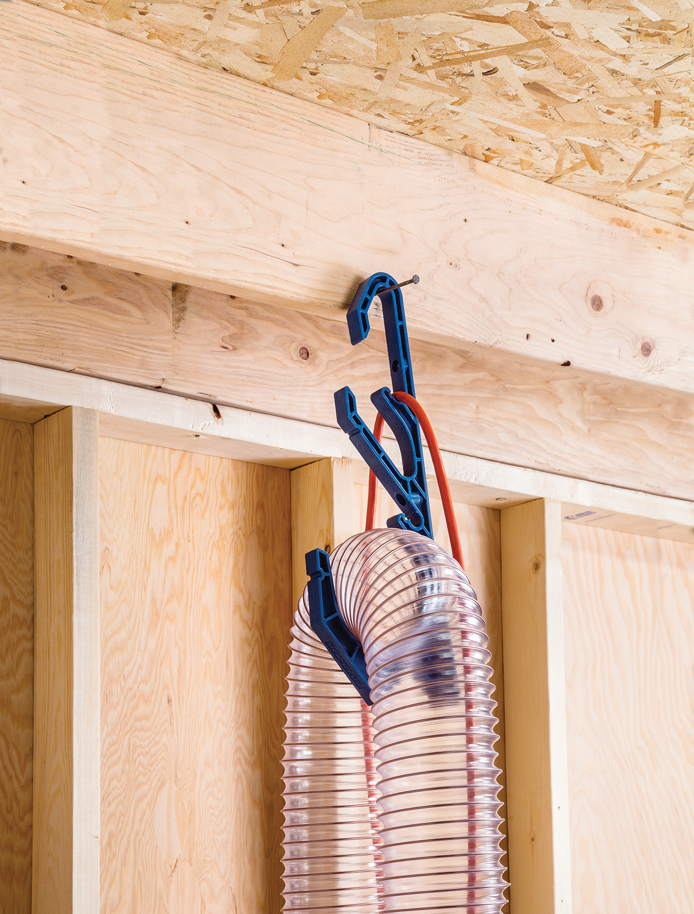 Hang the Dust Right Cord and Hose Hook from a nail or screw for better hose and cord management throughout the shop.