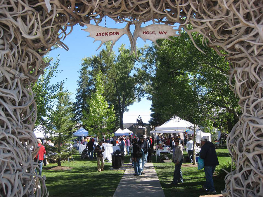 Many events of the Jackson Hole Fall Arts Festival such as the QuickDraw competition and the Art Auction occur on Jackson Town Square framed by naturally shed elk antler arches.