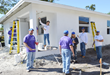 FLPLG and FAPIA work on house for Habitat of Humanity of Broward.
