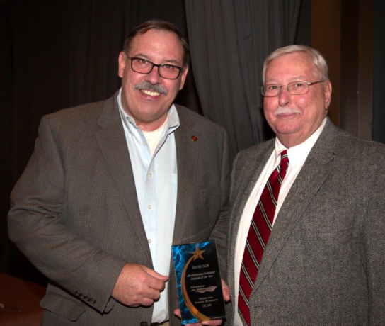 Allan Pavlick (left), vice president of Stertil ALM congratulated by Streator Mayor, Jimmy Lansford (right)