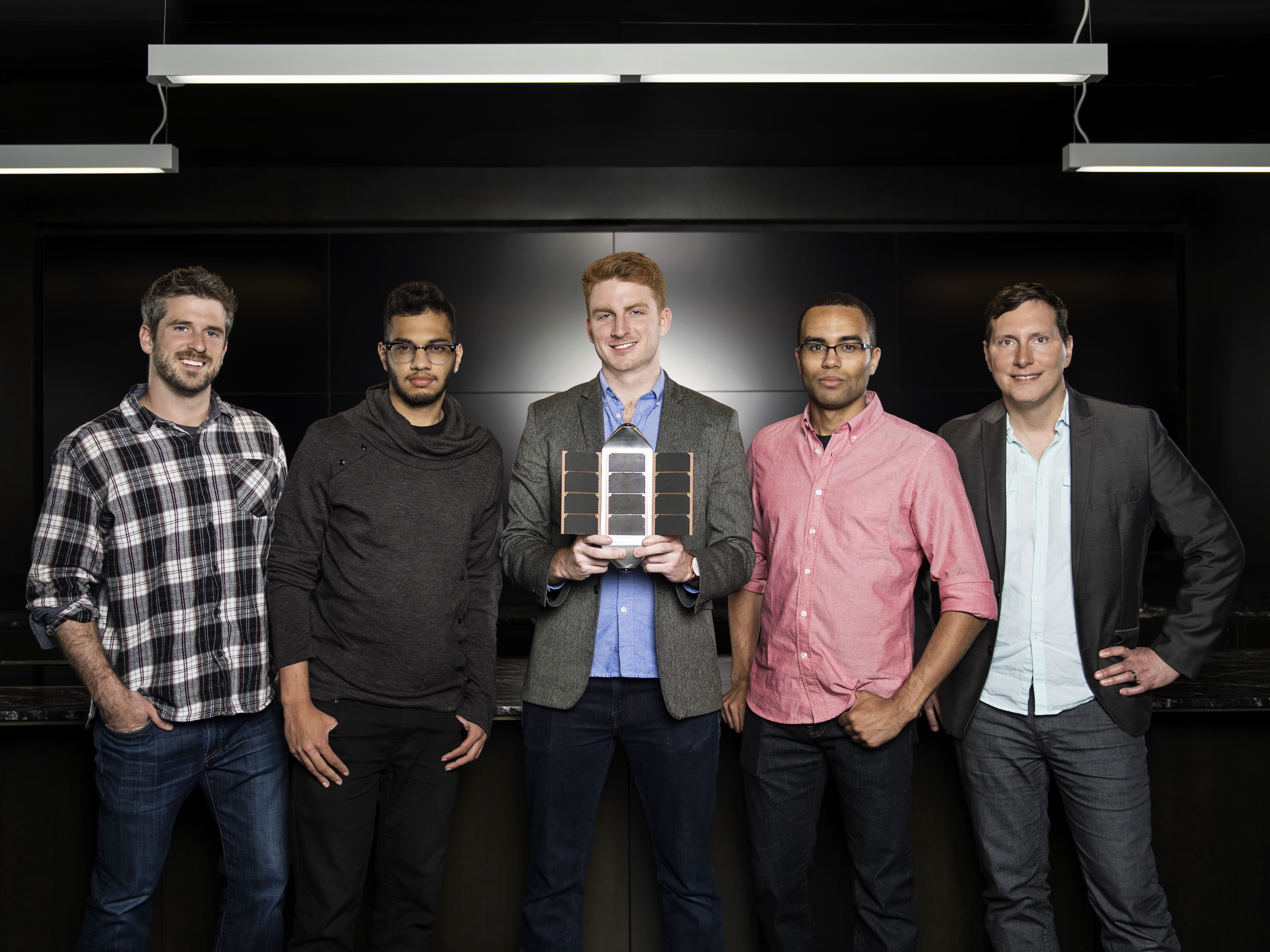Here the entire SpaceVR team displays their satellite prototype. From the left, Brad Farquar (Head of Sales) , Varun Vruddhula (Head of Strategy), Ryan Holmes (Founder & CEO), Blaze Sanders (CTO), Tim