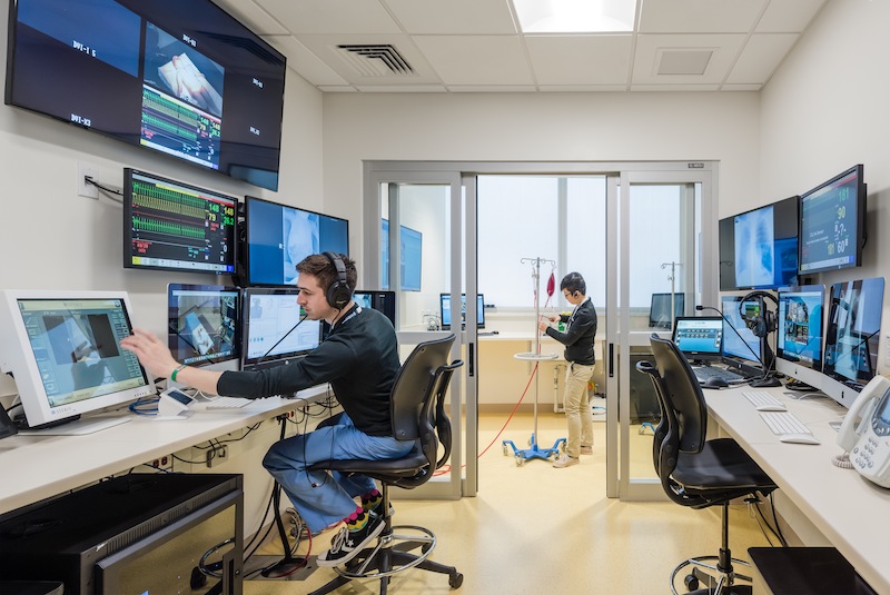 All SIM Center rooms — even the reception area and bathroom — are wired with microphones and cameras and connected to a large control room where technicians stage the simulations behind the scenes.