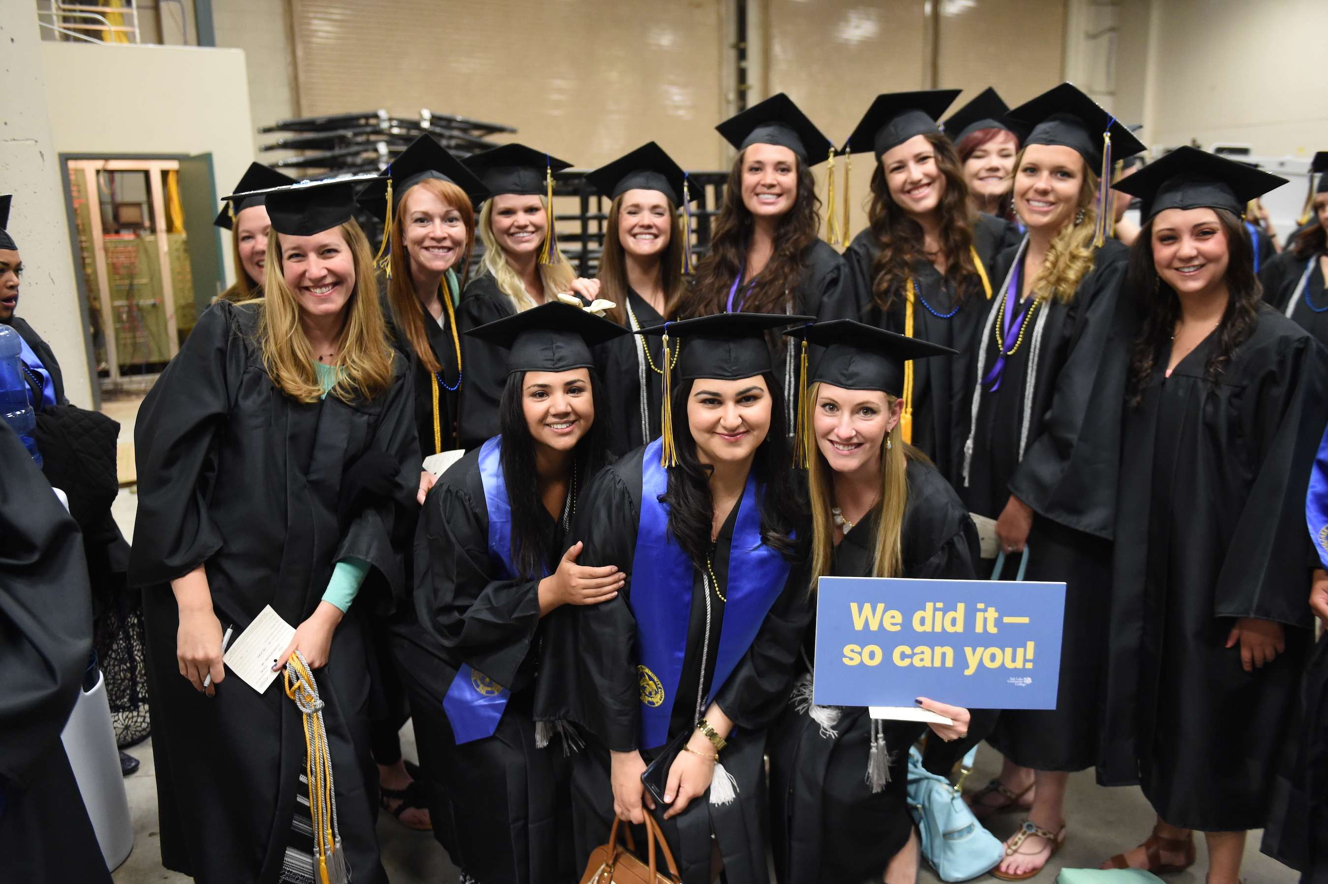 Graduates pause for a photo before the commencement ceremony for Salt Lake Community College.