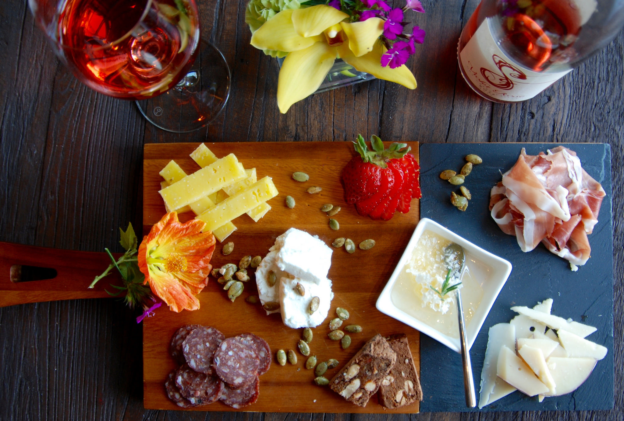 Charcuterie plate including local meats, cheeses, fruit and nuts-on menu at Spicy Vines