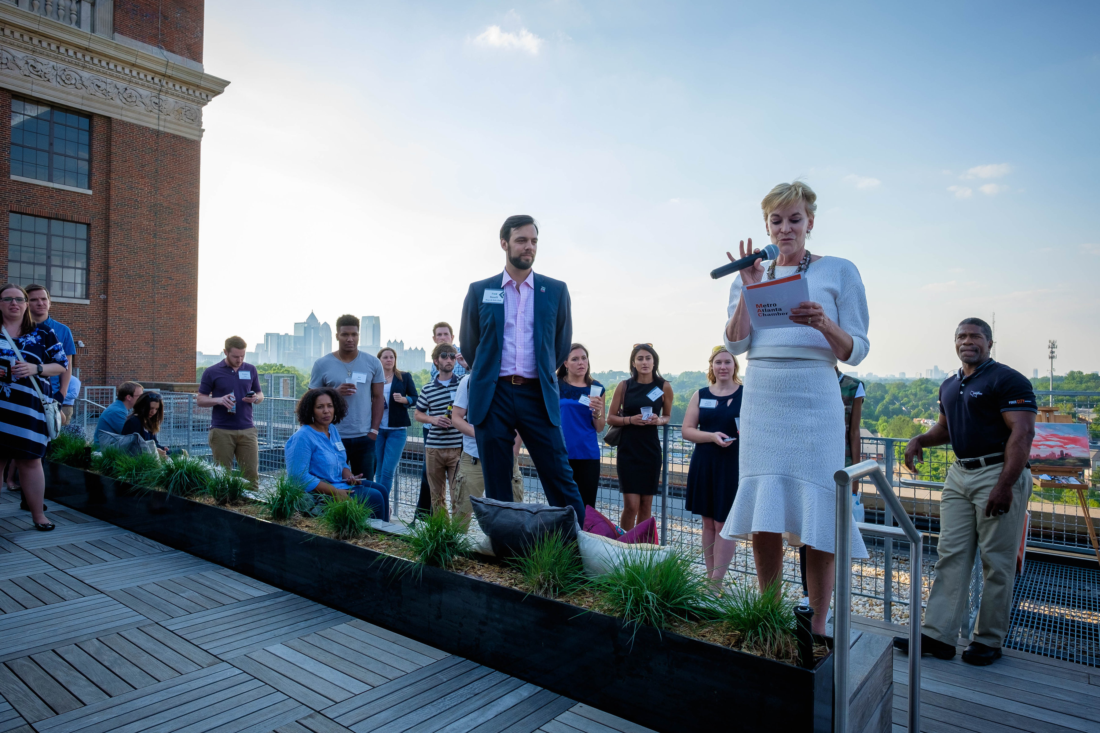Hala Moddelmog, president and CEO of the Metro Atlanta Chamber and Fred Roselli, chair of ATLeaders speak to the crowd at the launch party © Komich Photography
