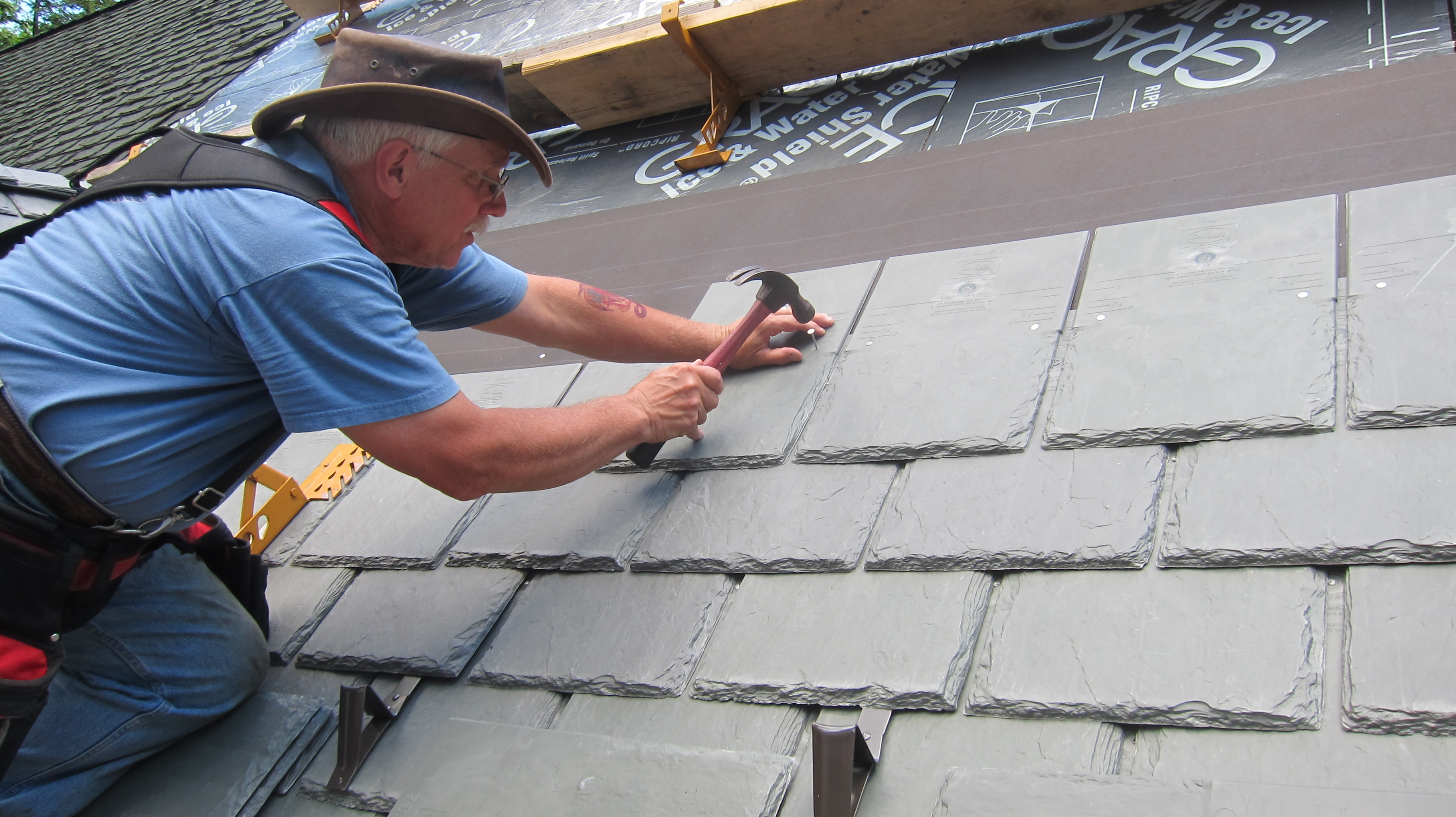 Tim Carter installing synthetic roofing from DaVinci Roofscapes, made in Kansas.