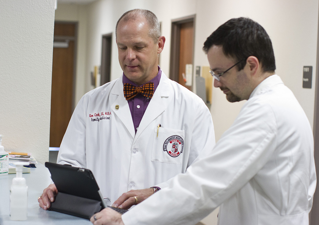 Dr. Ron Cook, chairman of the TTUHSC Department of Family Medicine and Dr. Chaz Willnauer working on clinical cases.