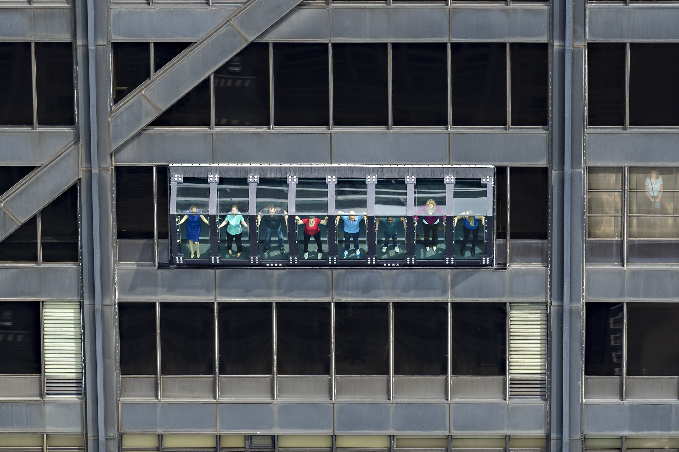 Eight bays tilt riders 30 degrees out over the Magnificent Mile from TILT at 360 CHICAGO Observation Deck