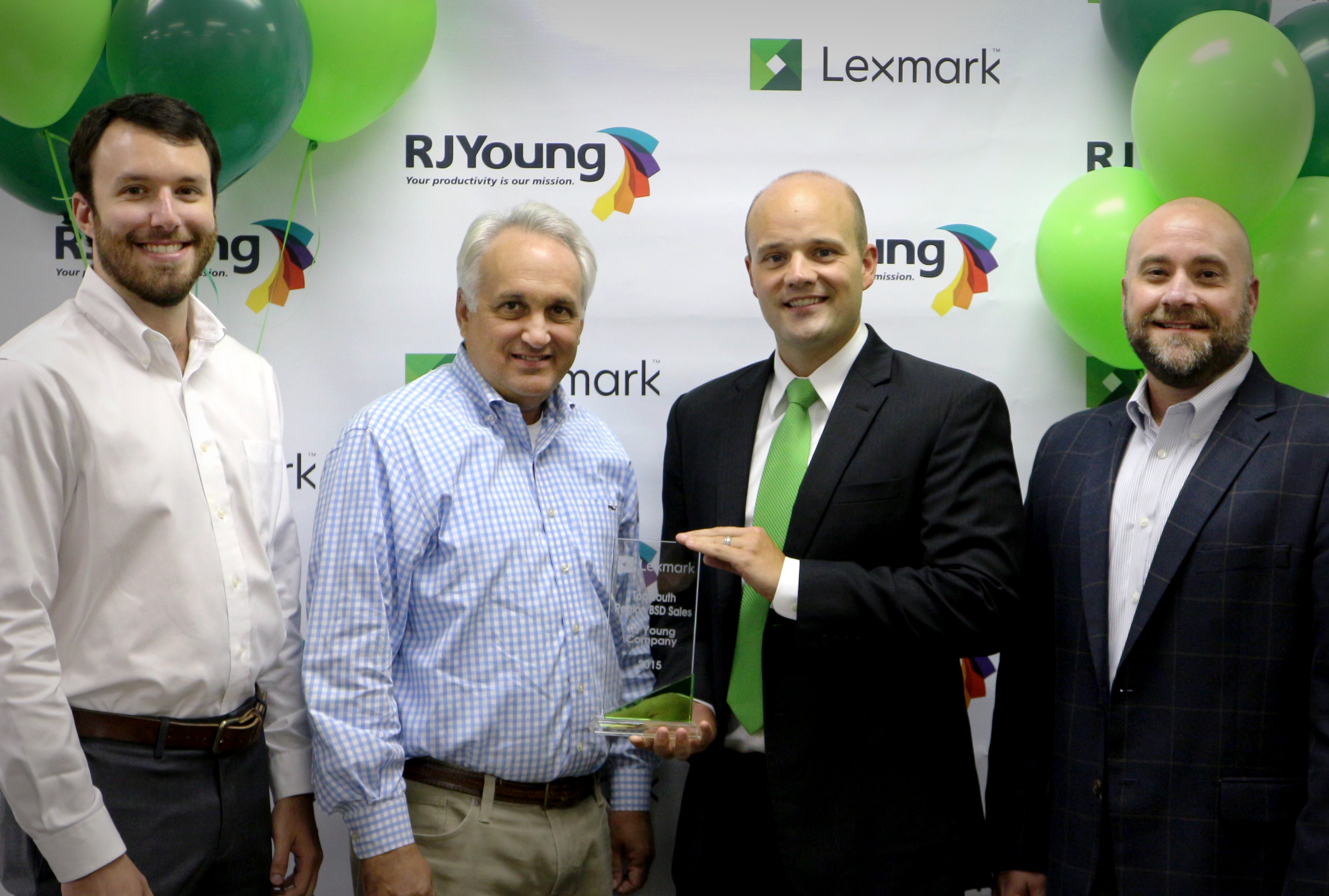 RJ Young President & CEO Accepts the Lexmark South Region Top Dealer Award 2015 from Jeff Dixon of Lexmark.