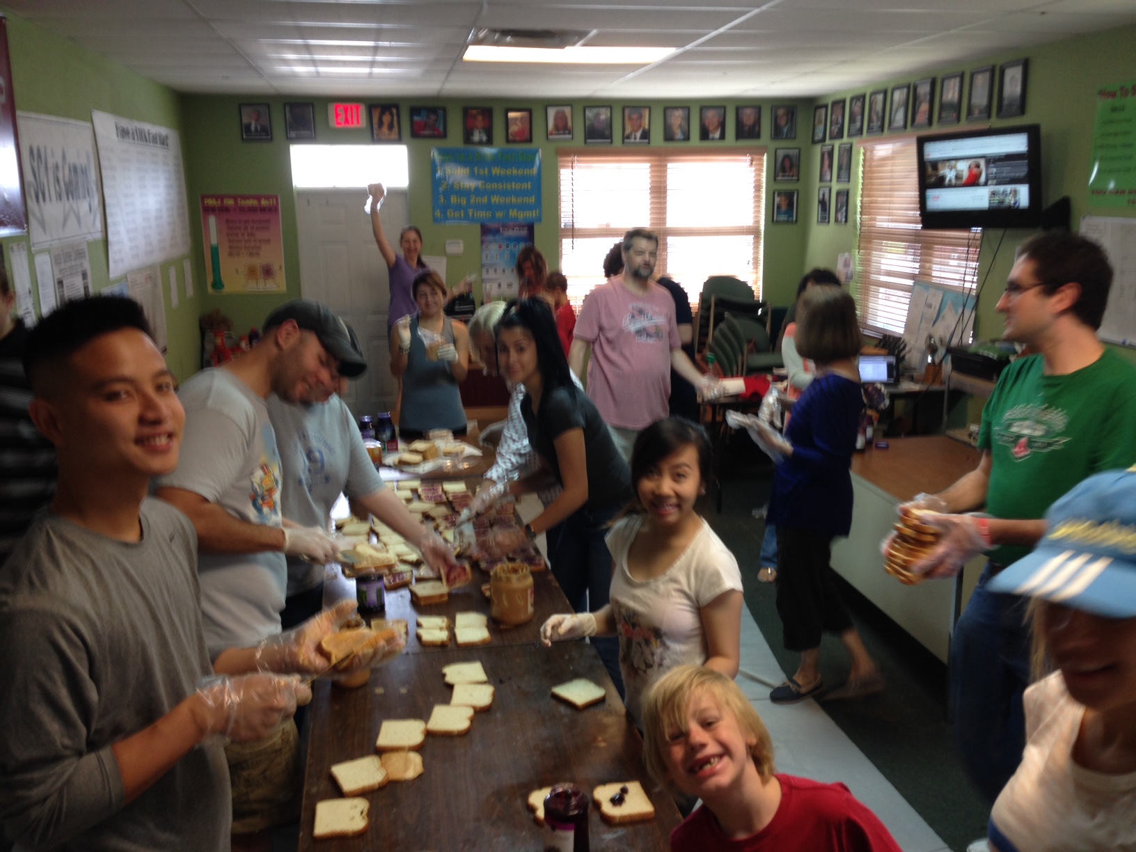 More than 100 volunteers have helped make sandwiches at PB&J for Tampa Bay Feeding Frenzies. Pictured are just a few of those volunteers May 2016 in Largo, Florida.