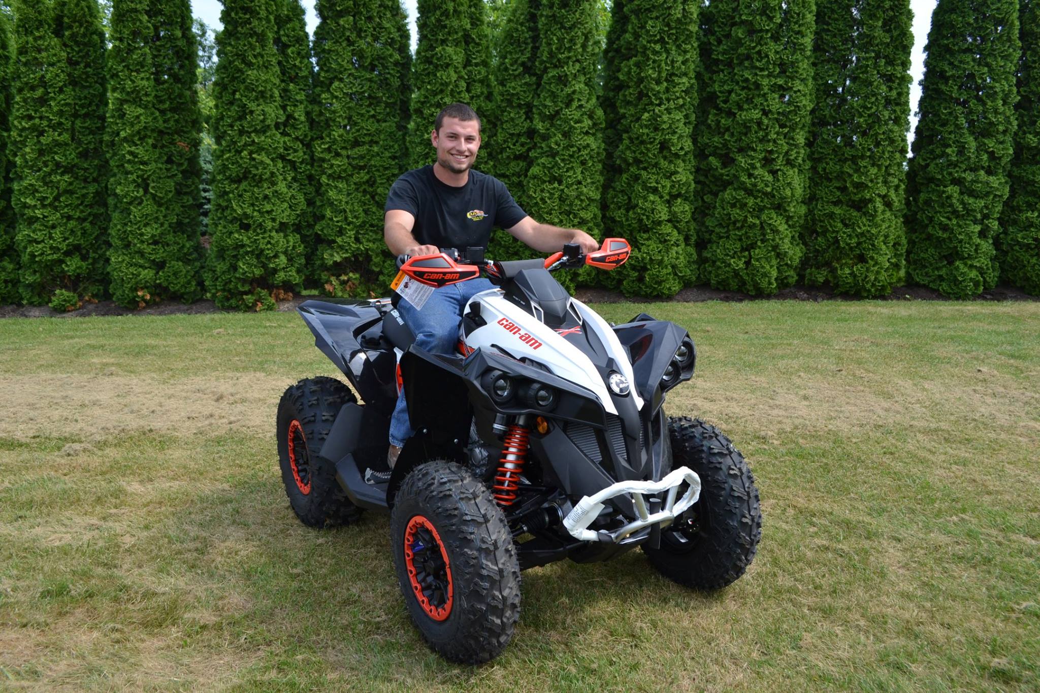 Chad Brooks, General Manager of Brooks PowerSports, Inc. poses on a new Can-Am Renegade ATV as it enters the dealership's inventory.