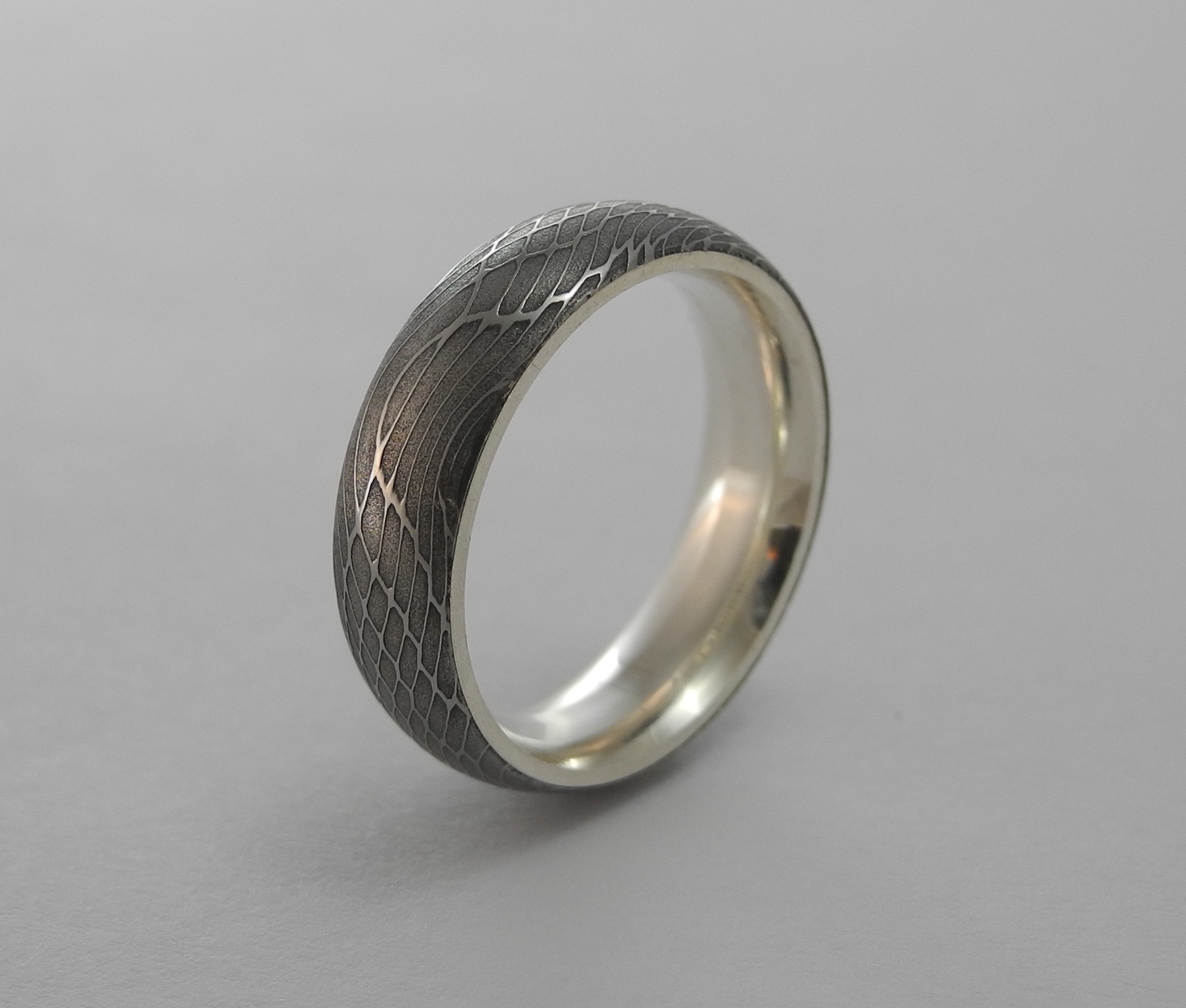 Spider Silk Damascus Ring with Silver Interior by Carbon 6