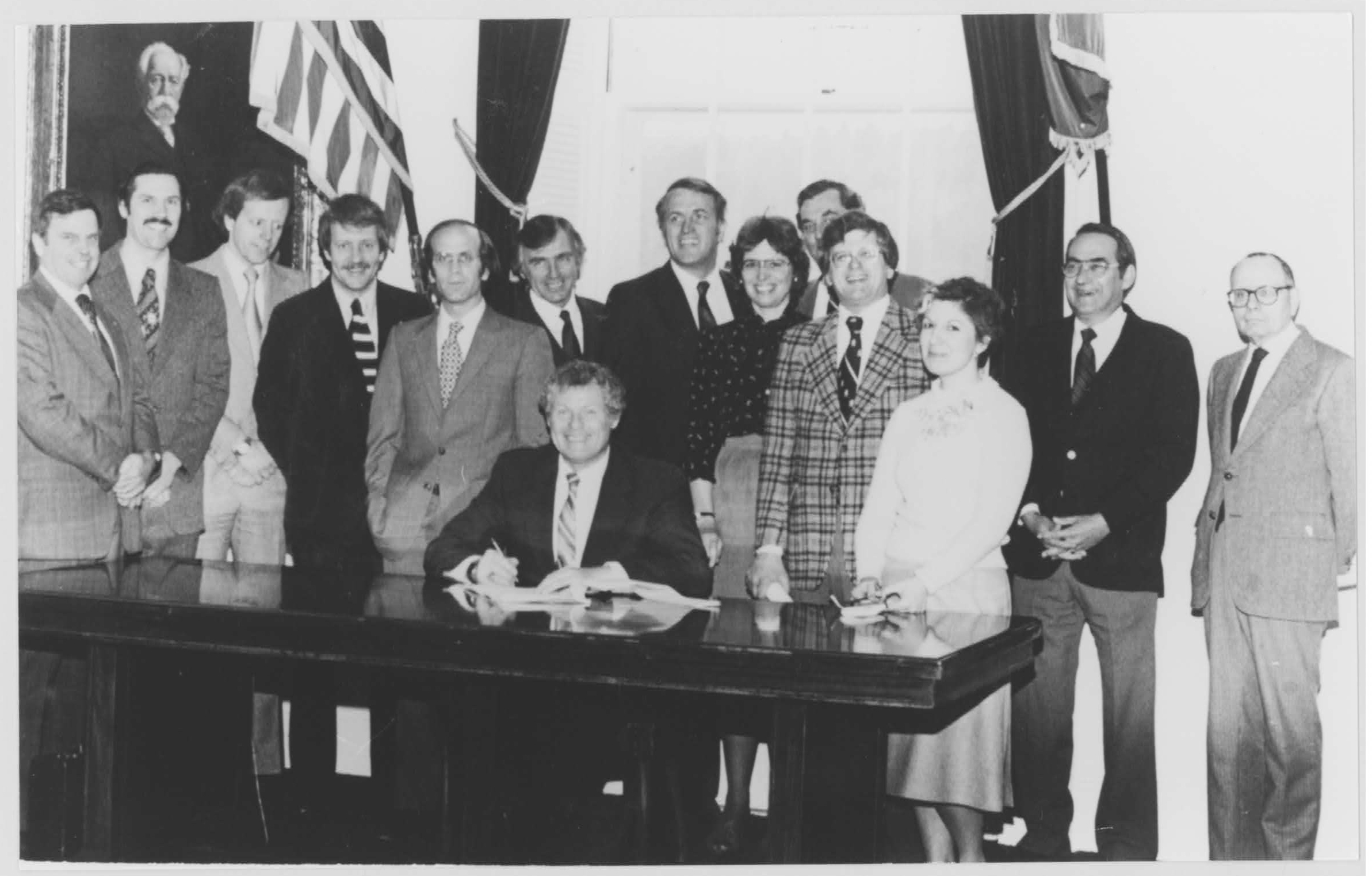 Governor Richard Snelling in 1981 signing Vermont's captive insurance legislation into law.