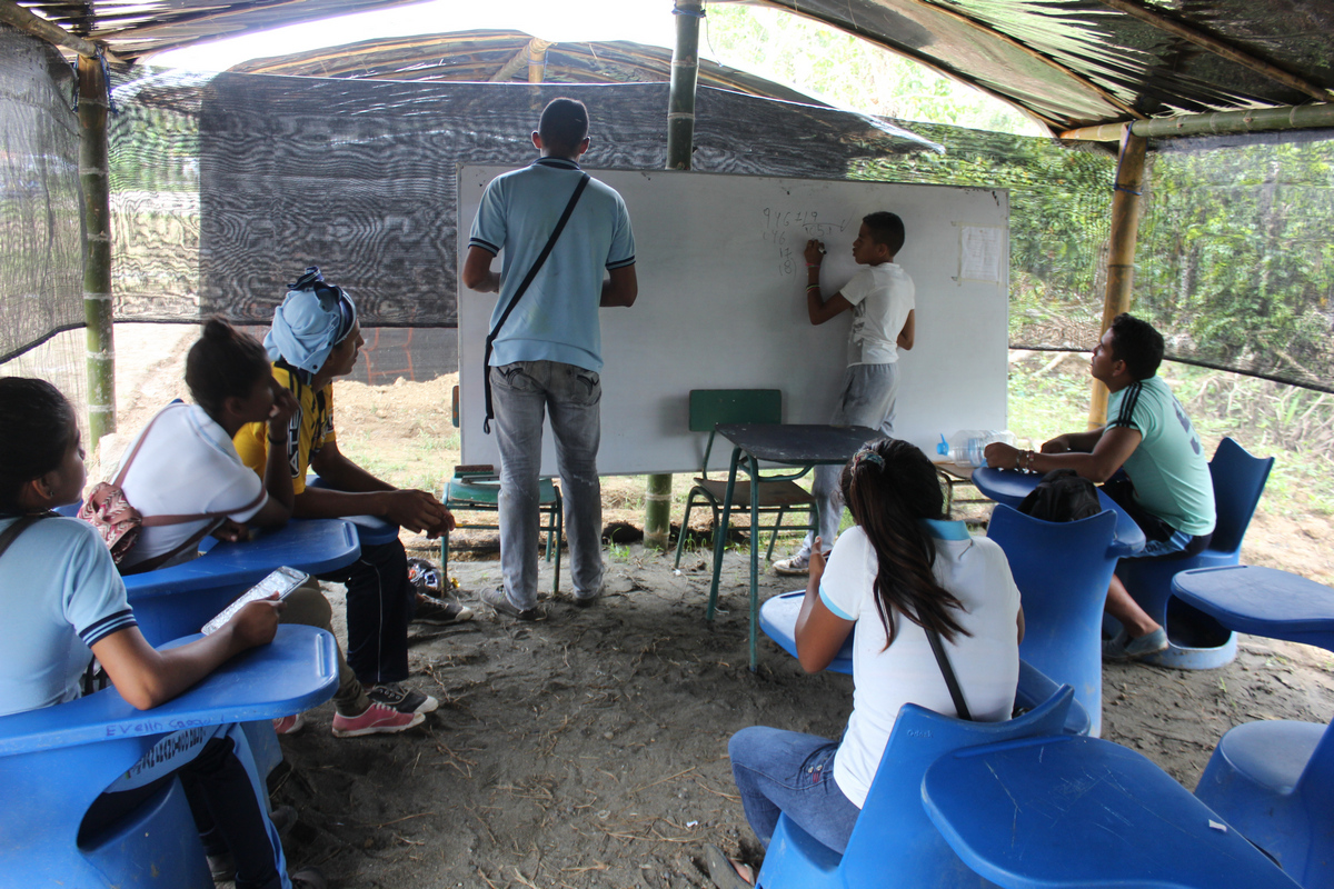 Students attend school in new classroom shelters.
