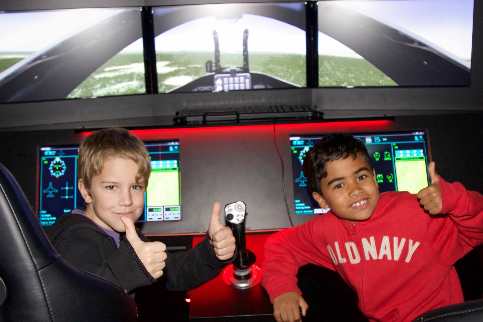 STEM Saturday students try out a flight simulator.