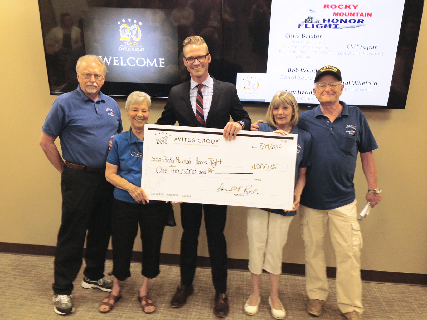 Avitus Group Business Development Manager & Honor Flight Volunteer Chris Balster Presents Rocky Mountain Honor Flight Board of Directors with Check for Business Challenge