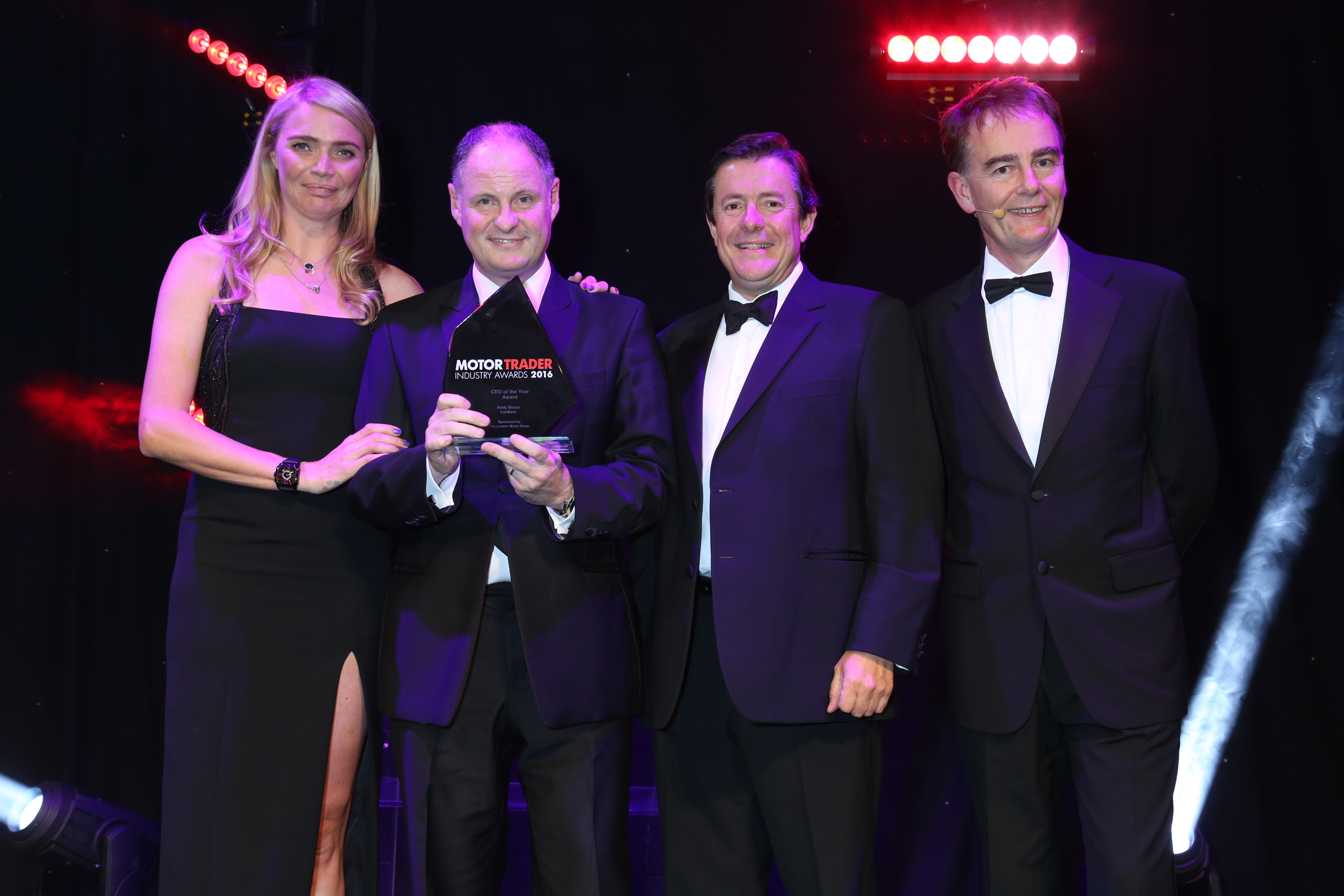 Andy Bruce, Lookers CEO receiving the Award from Jodie Kidd at Motor Trade Awards