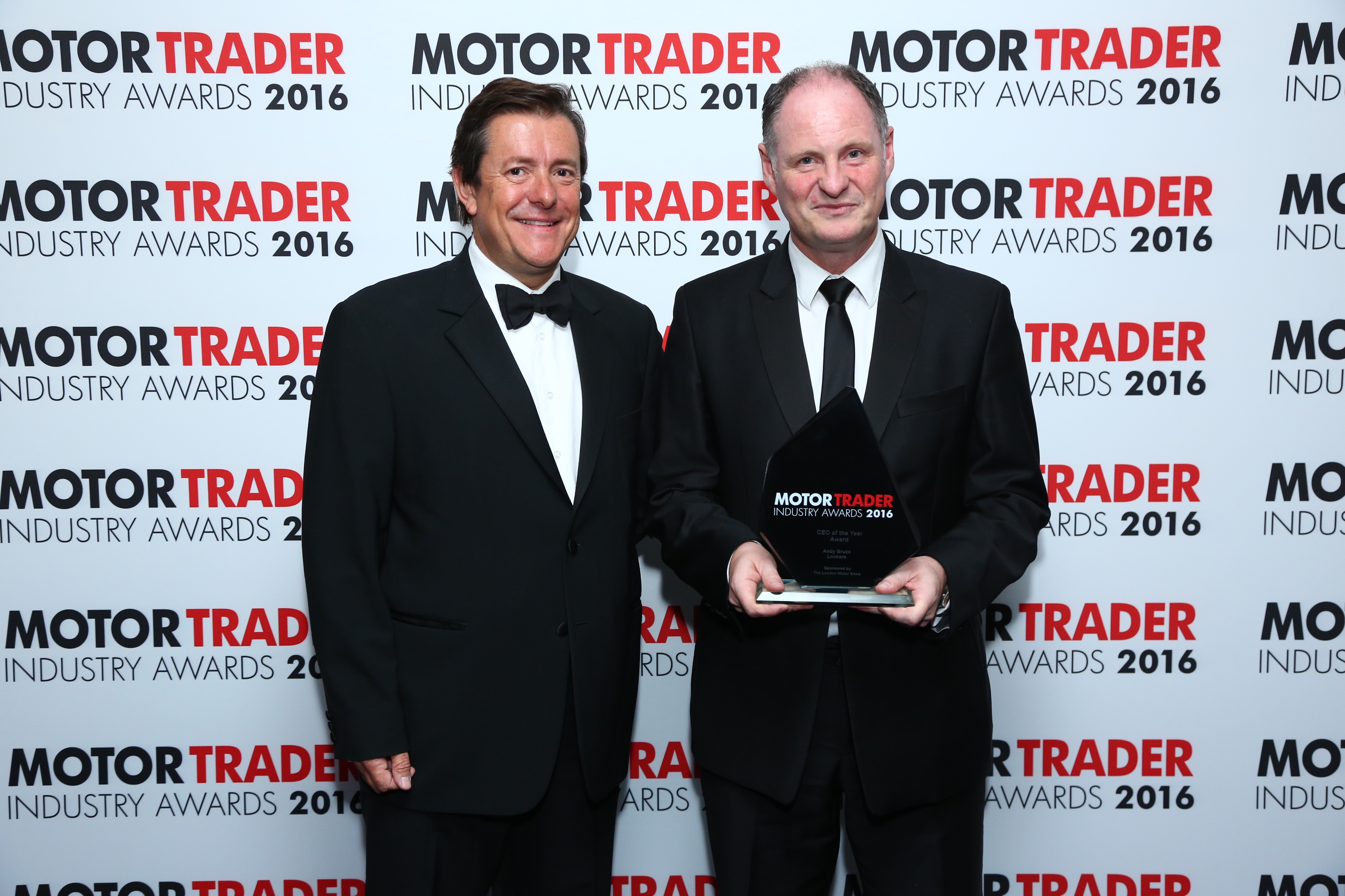 Andy Bruce receiving his award at the Motor Trader Awards