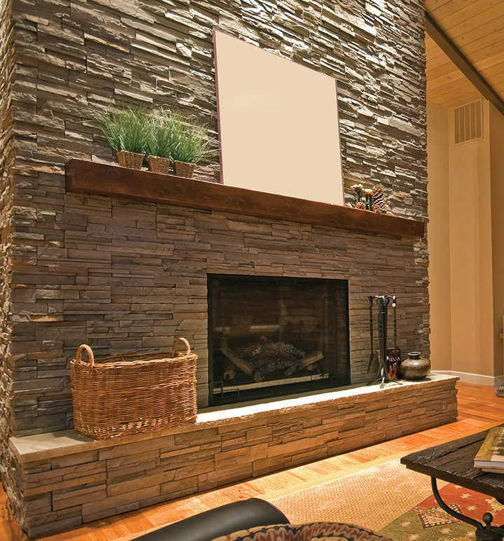 Fireplace, beautifully framed with stone clone panels