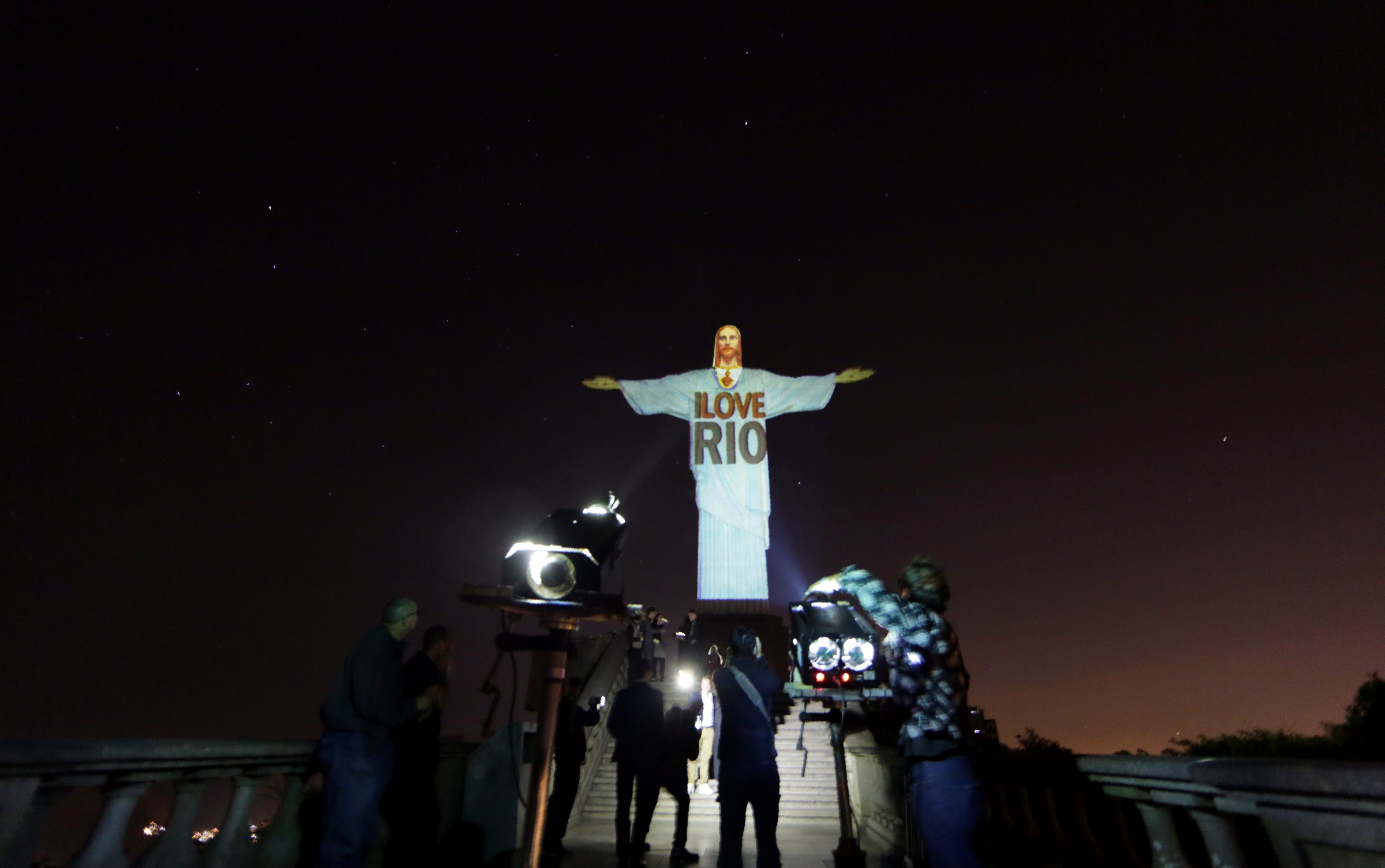 Projecting I LOVE RIO on Christ the redeemer statue