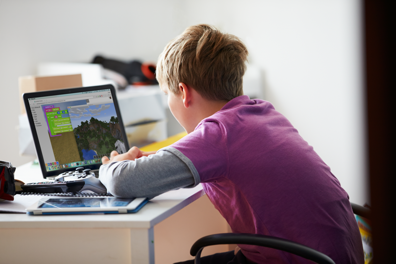 Boy using LearnToMod Minecraft Modding E-Learning Software
