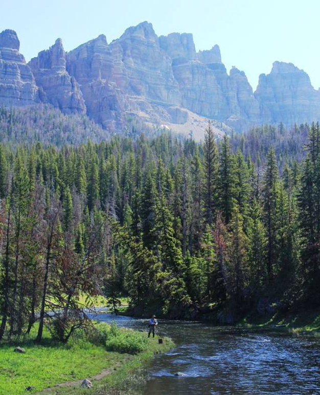 Fishing in trout-filled Shoshone National Forest backcountry rivers and lakes is one of several fresh air activities to enjoy at Brooks Lake Lodge & Spa in Wyoming.