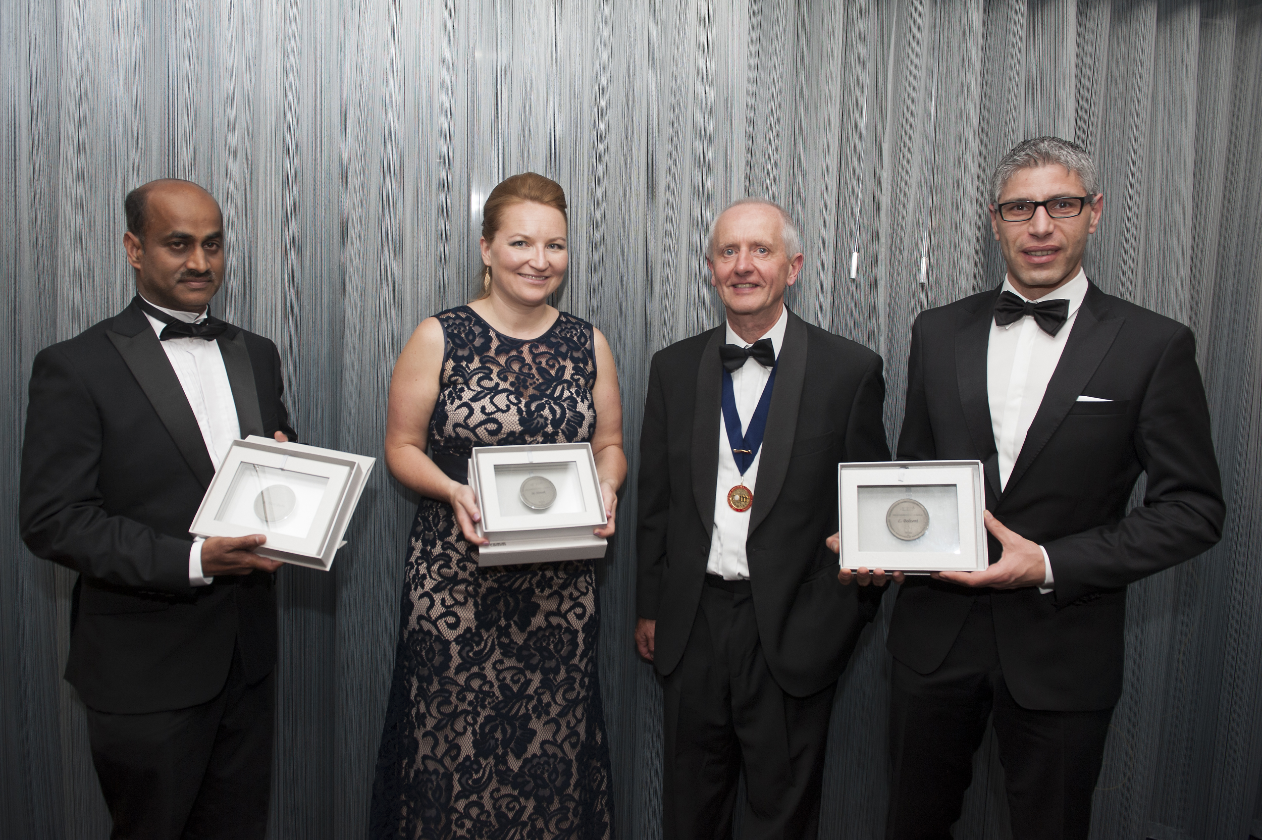 2016 Charles Hatchett Award Winners receiving their medals from IOM3. Pictured from left: Hari-Babu Nadendla, Magdalena Nowak, IOM3 President Mike Hicks, and Leandro Bolzoni.