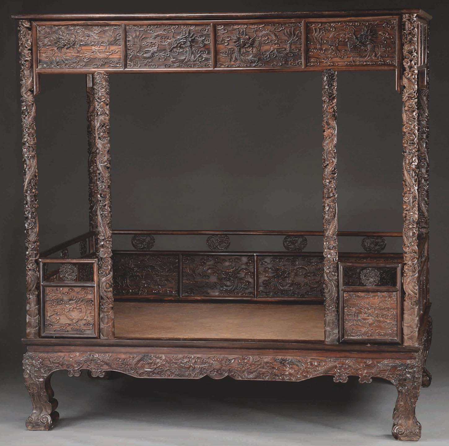 An Outstanding Chinese Zitan Carved Canopy Bed Realized $33,180.