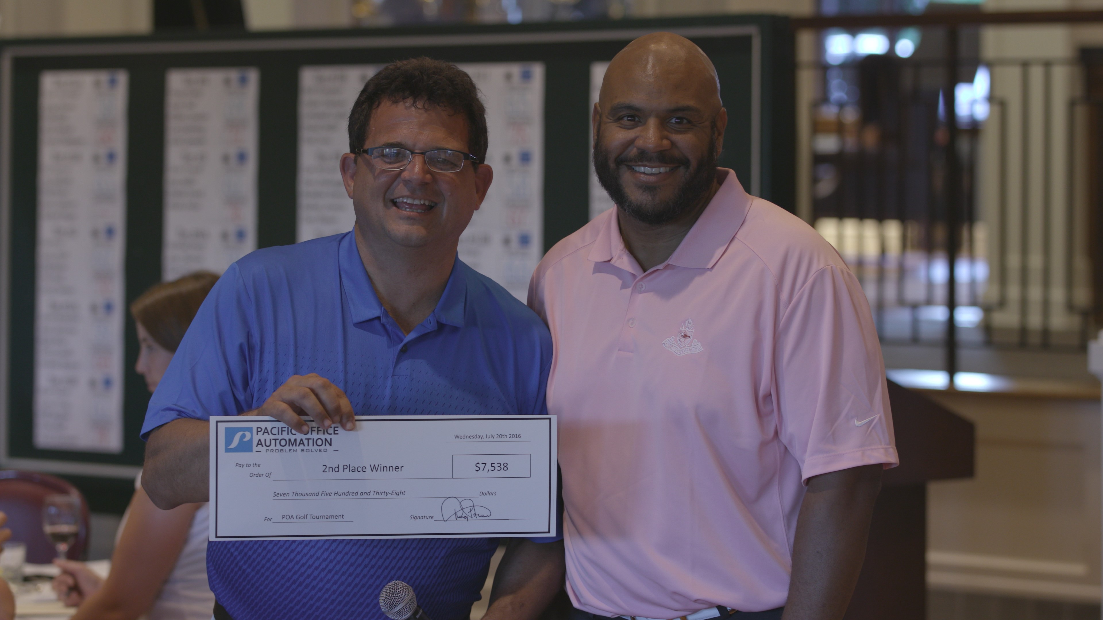 Representative from Boys & Girls Clubs of Portland receiving the 2nd place donation from Doug Pitassi, Pacific Office Automation president