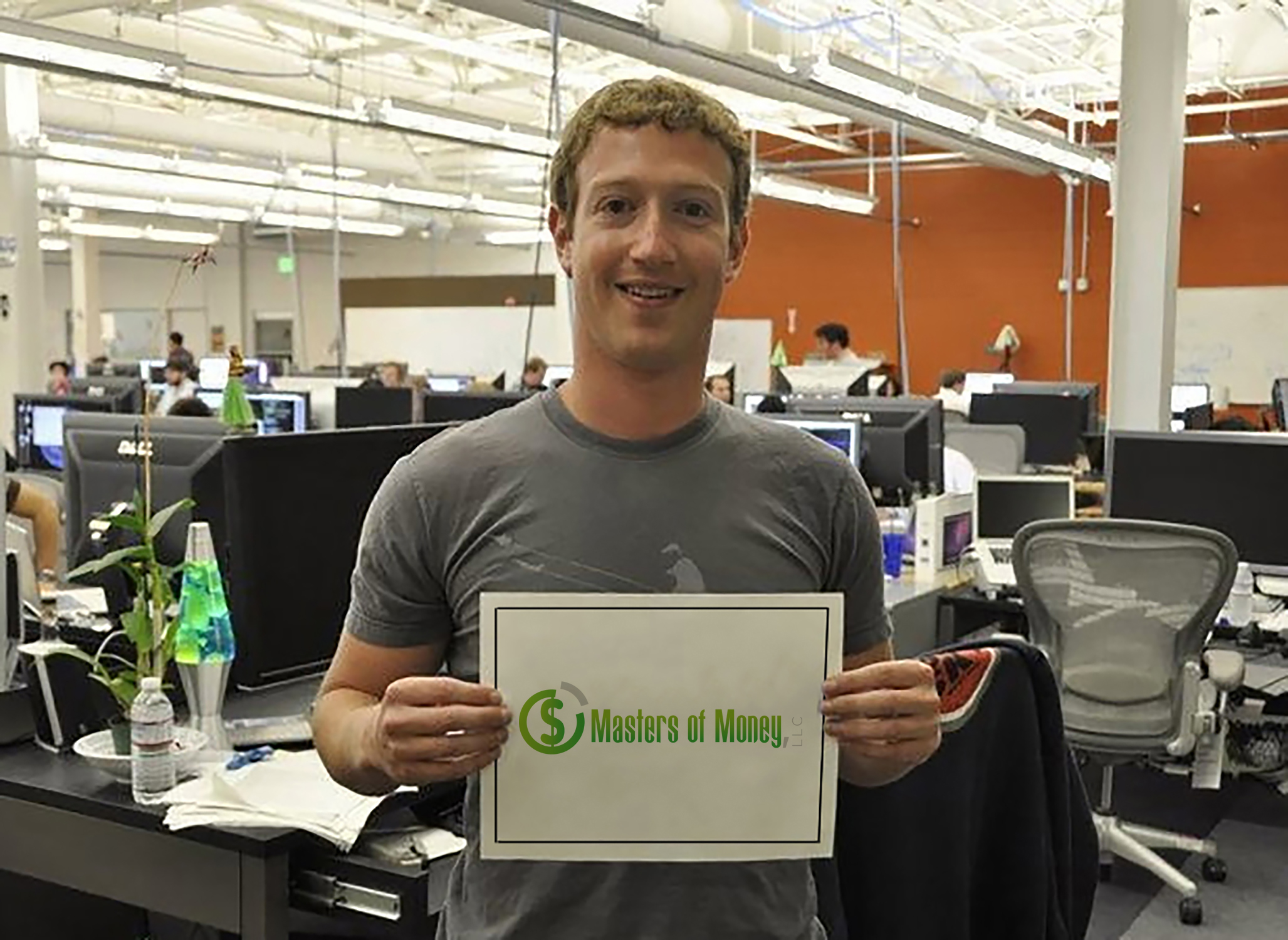 Mark Zuckerberg holding a Masters of Money logo sign.
