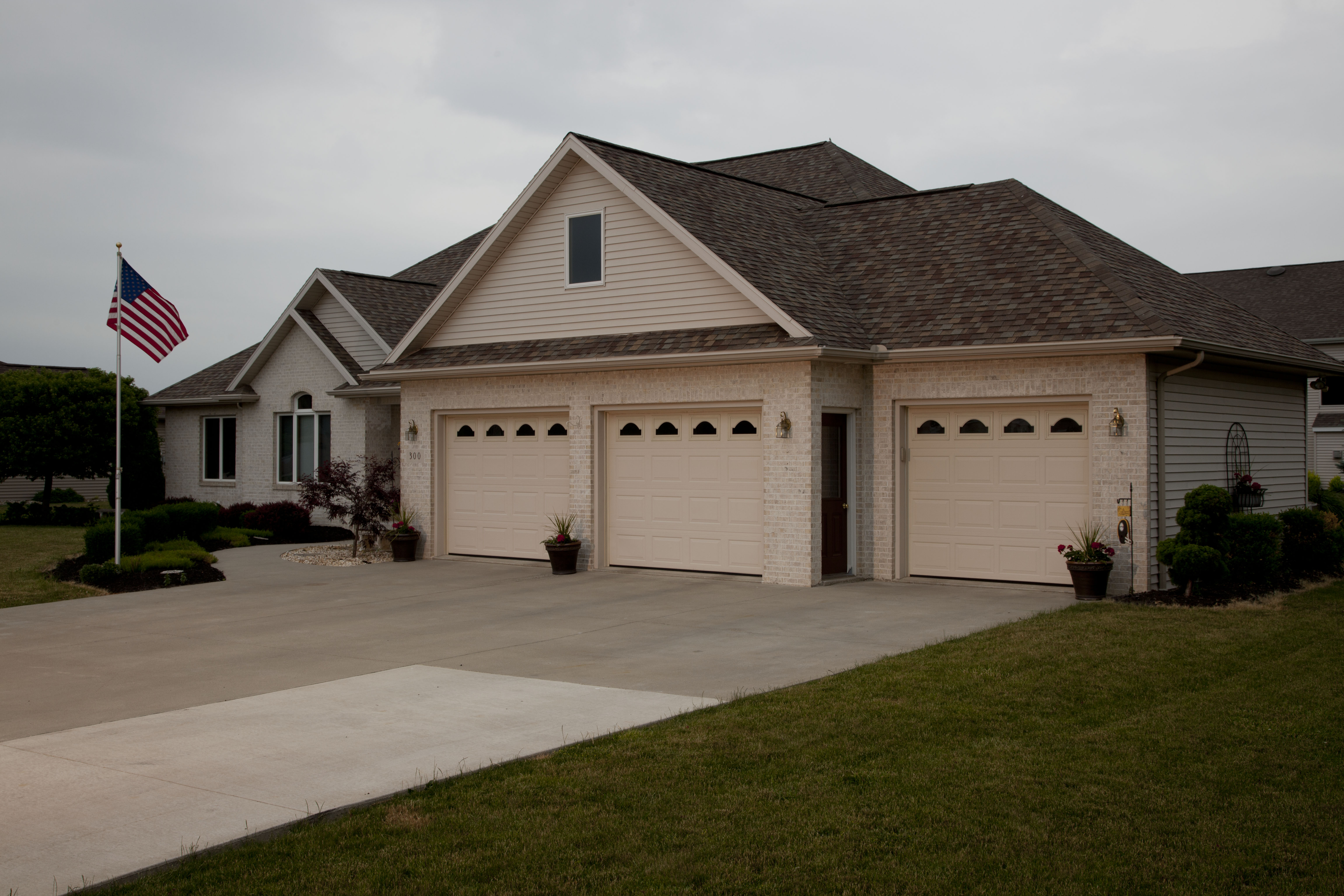 Insulated aluminum garage doors from Haas Door help keep home energy bills low.