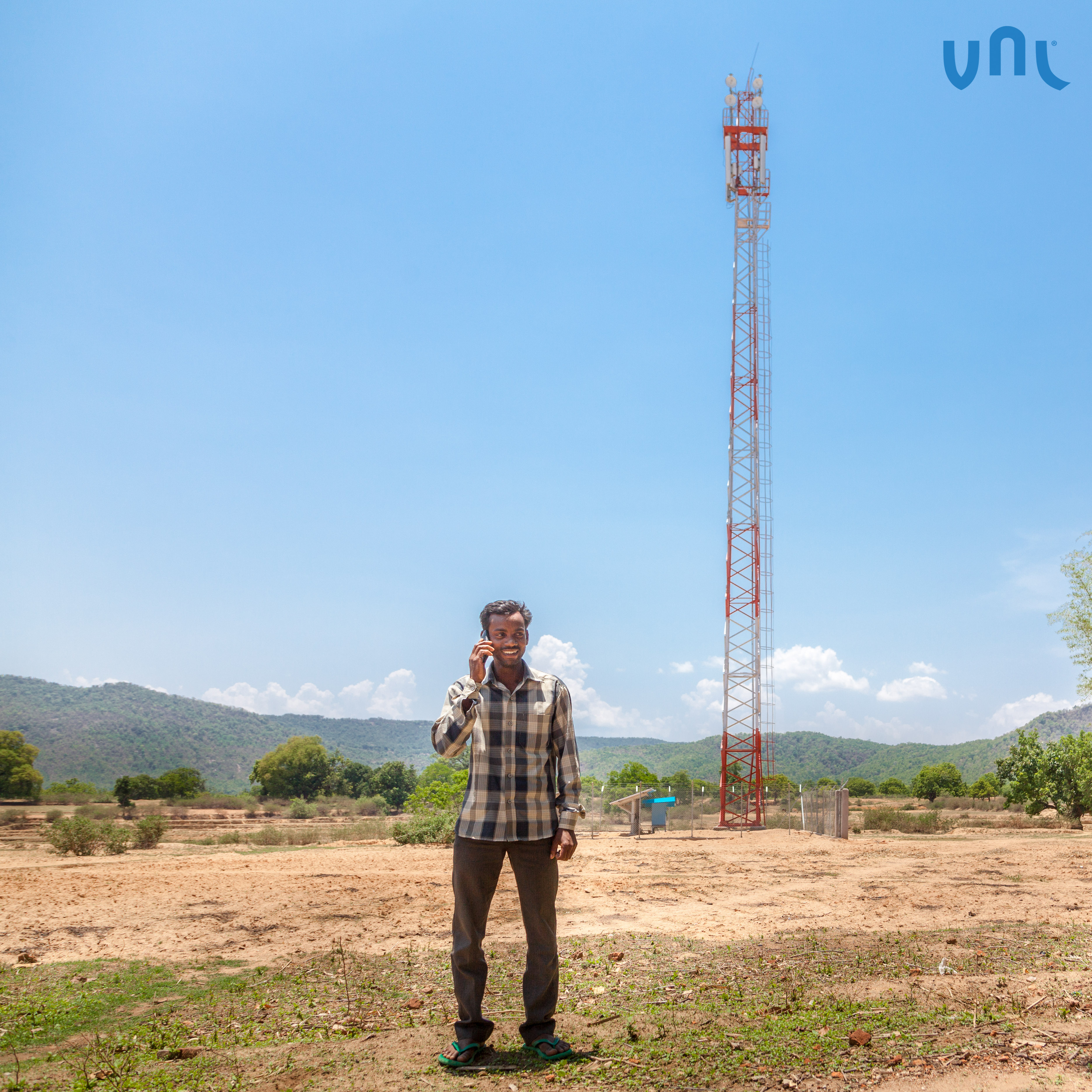 Man talking on mobile phone in Jharkhand, India, using BSNL's network Powered by VNL