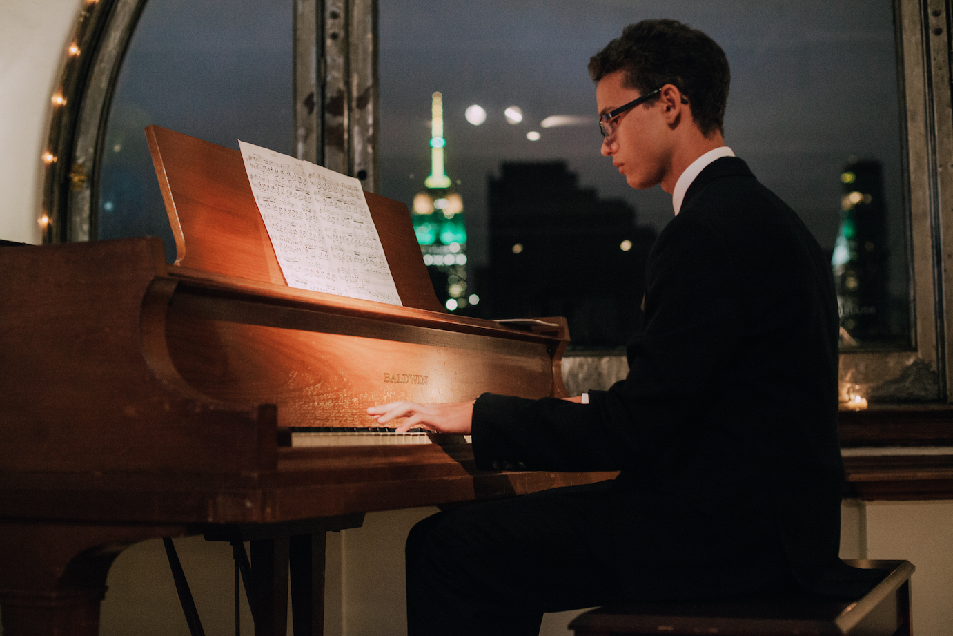 Mihai Stefanescu, a 16-year-old Save One Life beneficiary and award-winning pianist from Romania, performs for guests