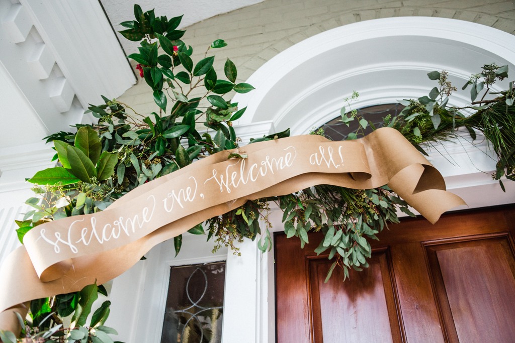 Entertain holiday guests with a greeting that trims the front door. Christy Hulsey and Amanda Currier of Colonial House of Flowers in Statesboro, GA embellished the front door with a garland of local