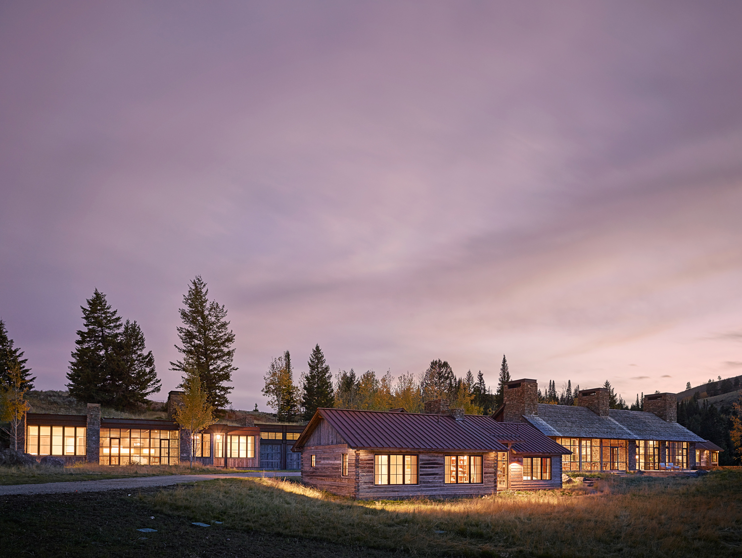 The WRJ Design interiors of the award-winning home, constructed near Jackson, Wyoming, by architect/contractor team JLF Design Build, juxtapose sleek contemporary with rustic timber and stone.