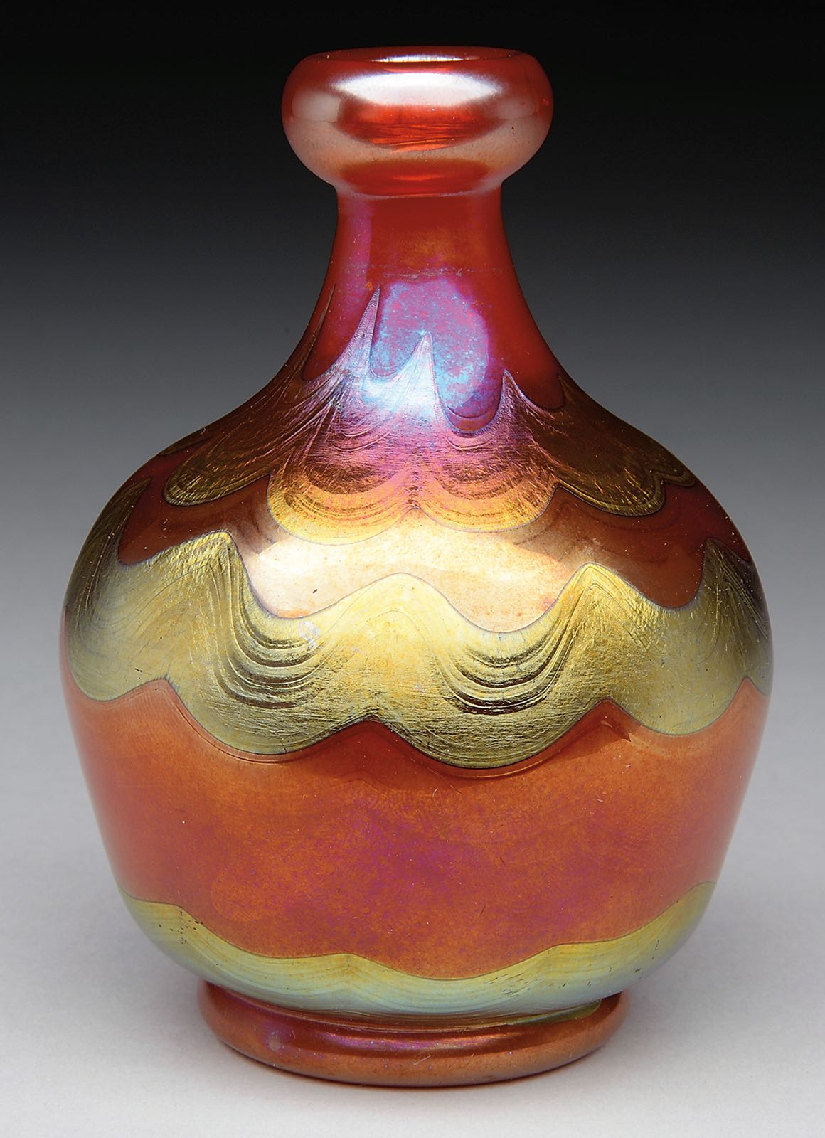 Lot #1258, a Tiffany Red Favrile Vase estimated at $7,000-10,000.