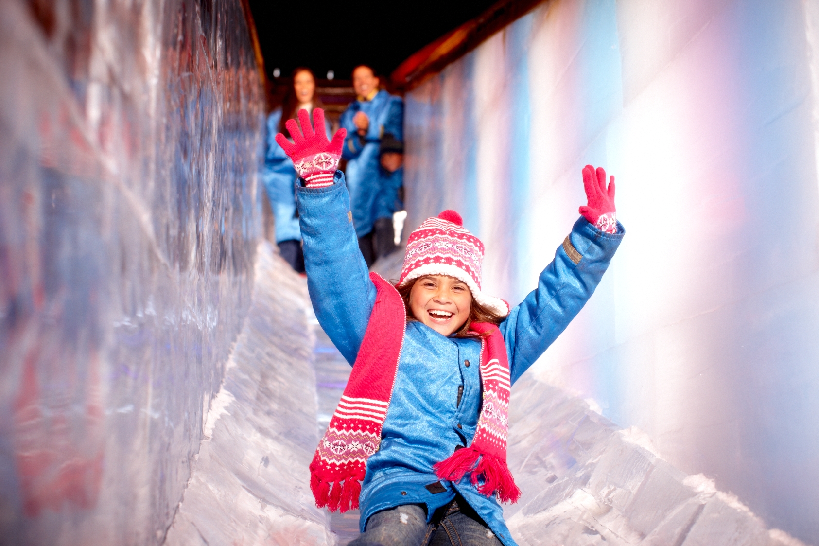 ICE! features two million pounds of frozen scenes, sculptures, and even slides!