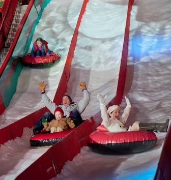 Take a thrilling ride down our two-story tall, 12-lane snow tubing hill made with real snow!