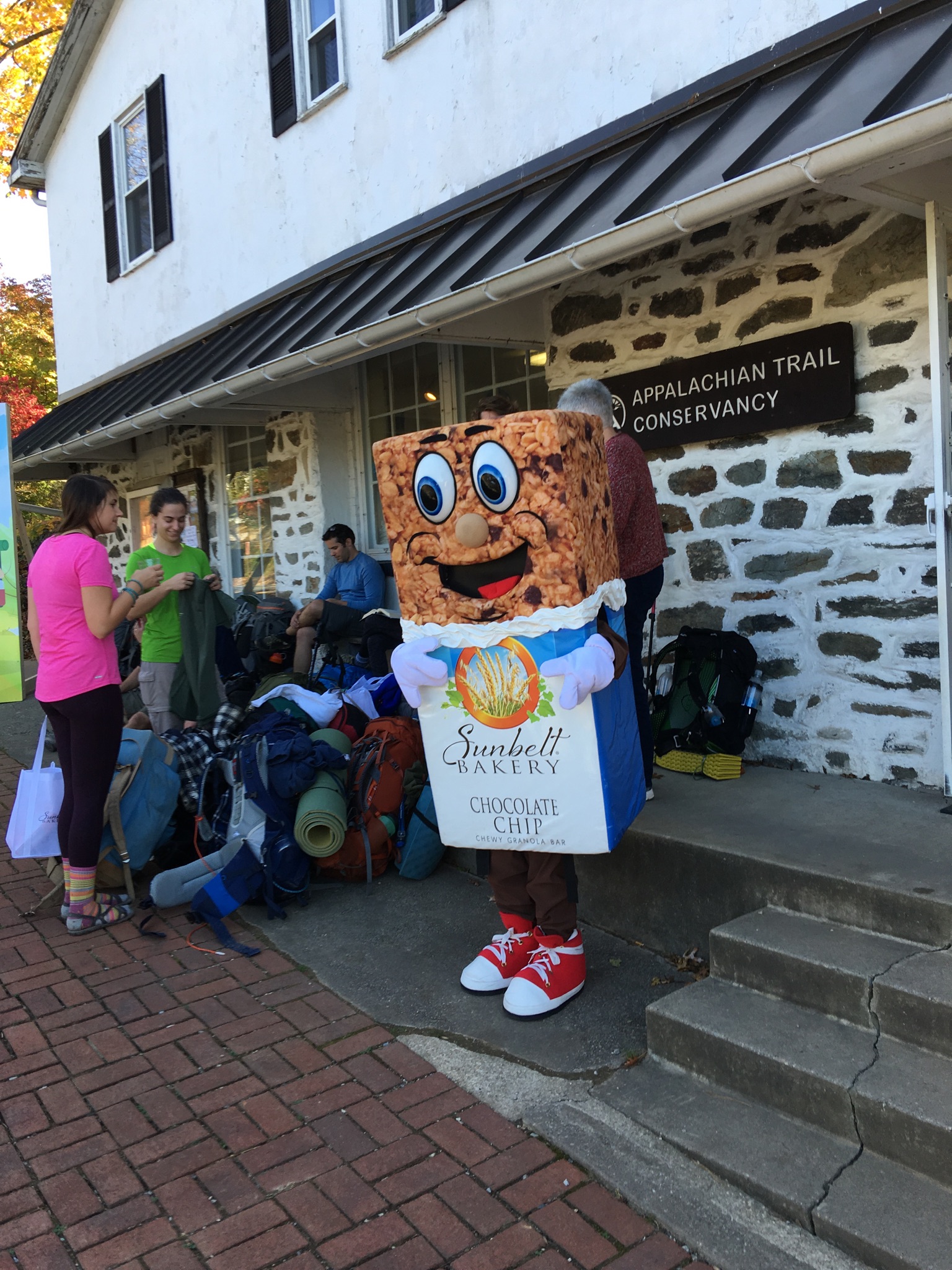 Supporters gather with Sunbelt Bakery's mascot Chip during the “Taste of the Trail” Event at the ATC Visitors Center in Harpers Ferry, W.V. on Nov. 6.