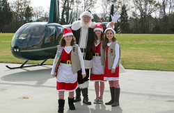 Santa landing at Planes, Trains and Santa model train show