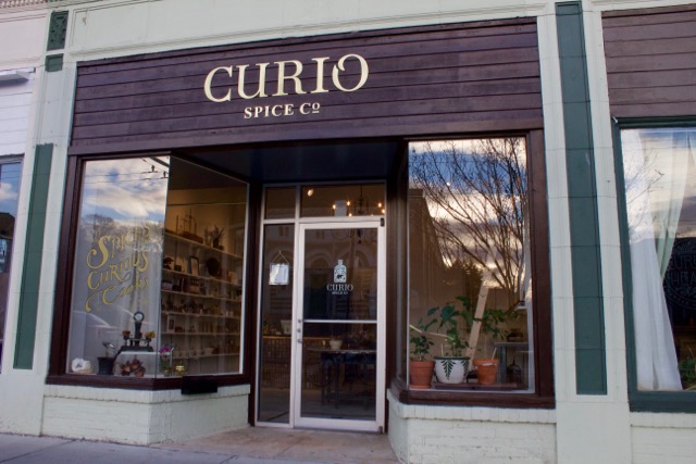 Curio's storefront welcomes customers to a vintage, apothecary experience.