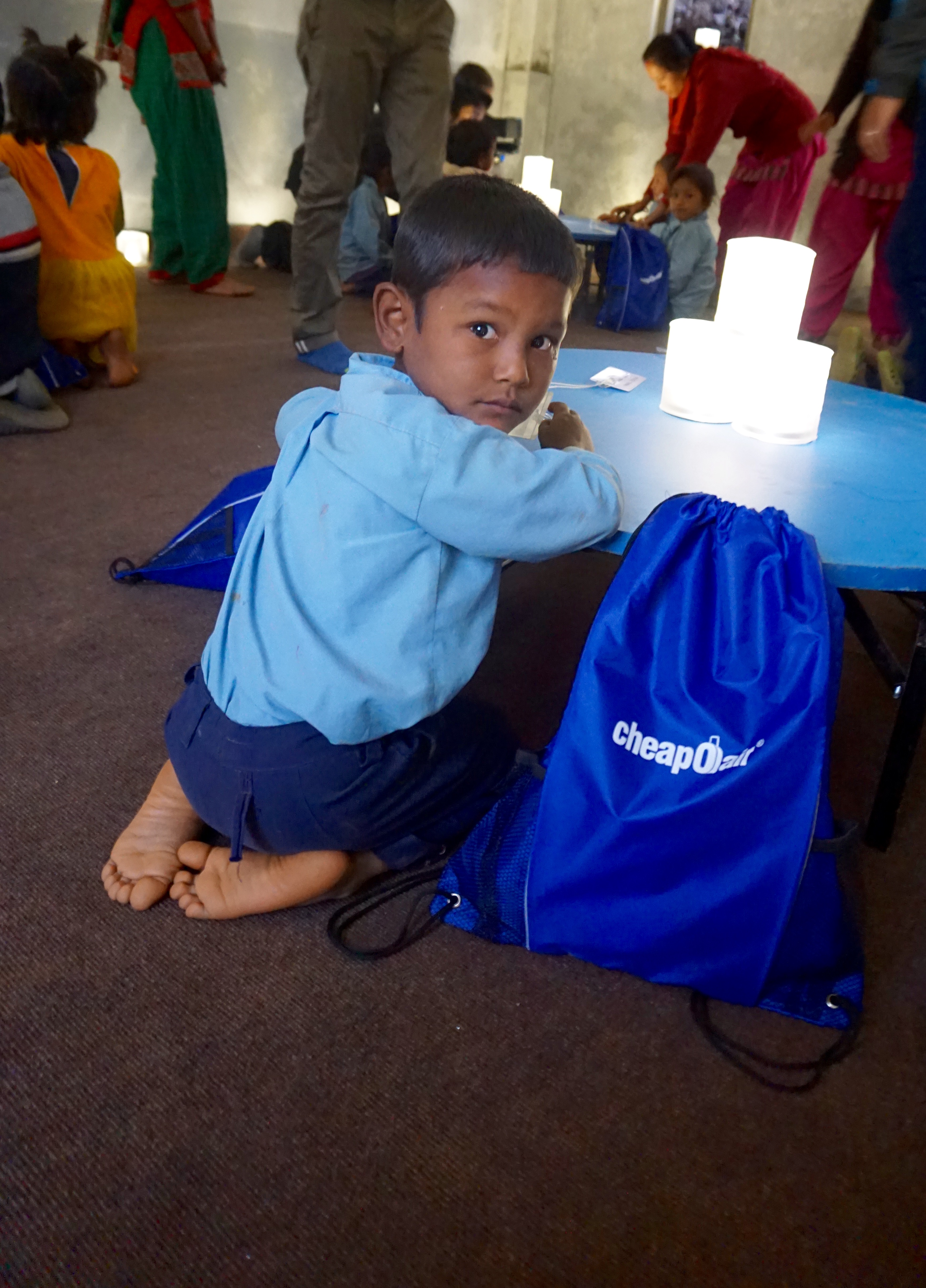 Nepali child receives solar-powered lights and school supplies