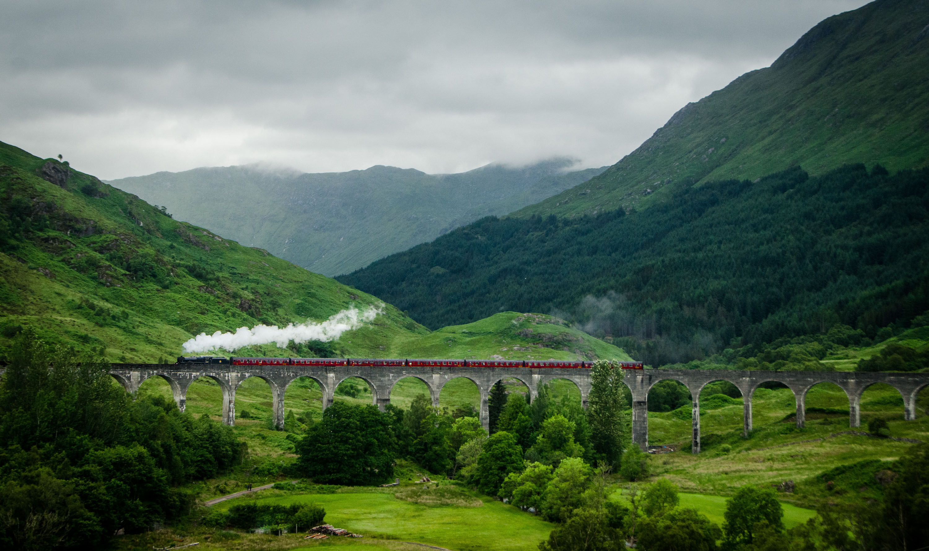 Participants will ride an historic steam train across Glenfinnan Viaduct in Scotland.