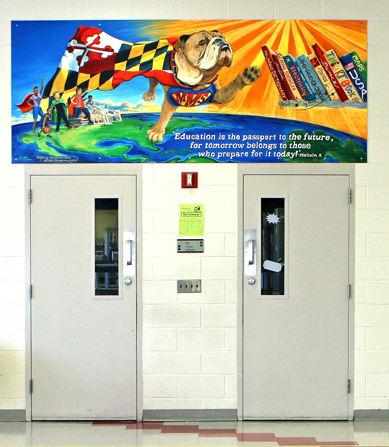 The Meade Middle School cafeteria entrance is now adorned with a colorful mural featuring the school district's bulldog mascot.