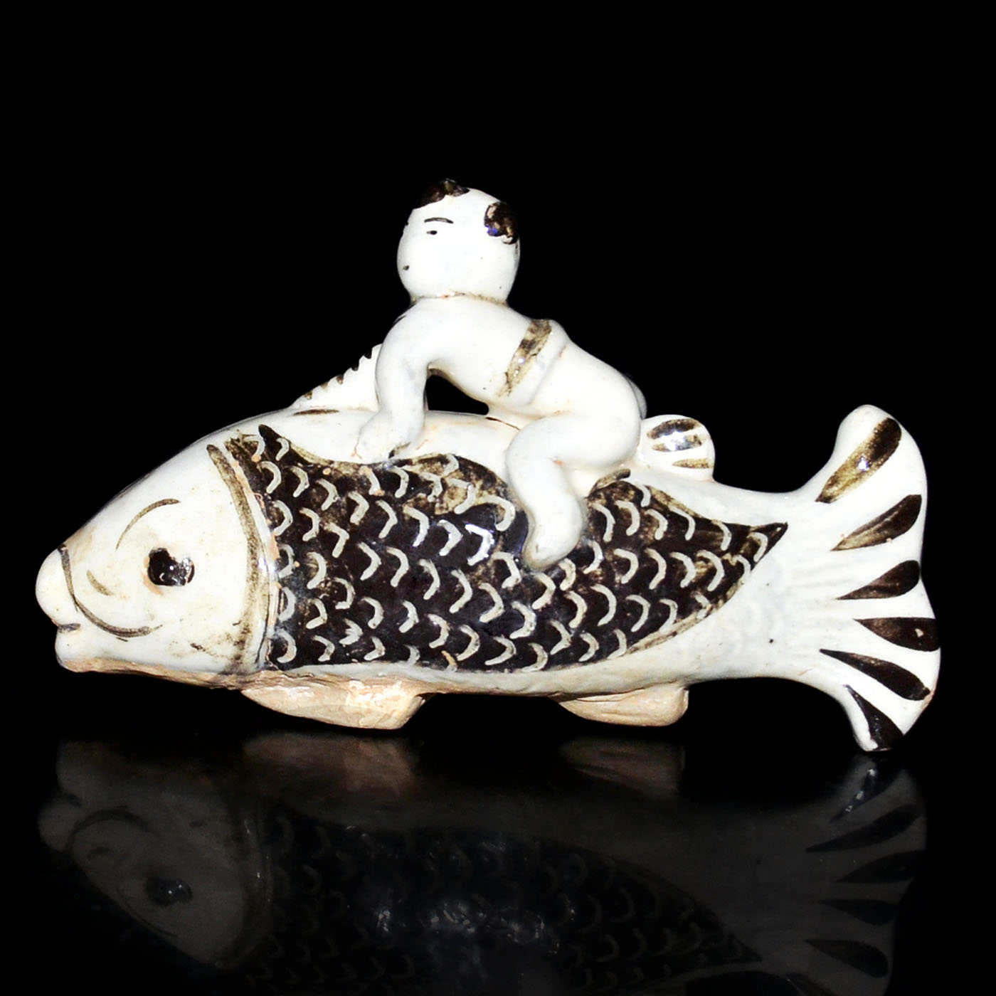 Boy riding a fish, one of the classical ceramic bargains in Gianguan Auctions' December 10 sale.