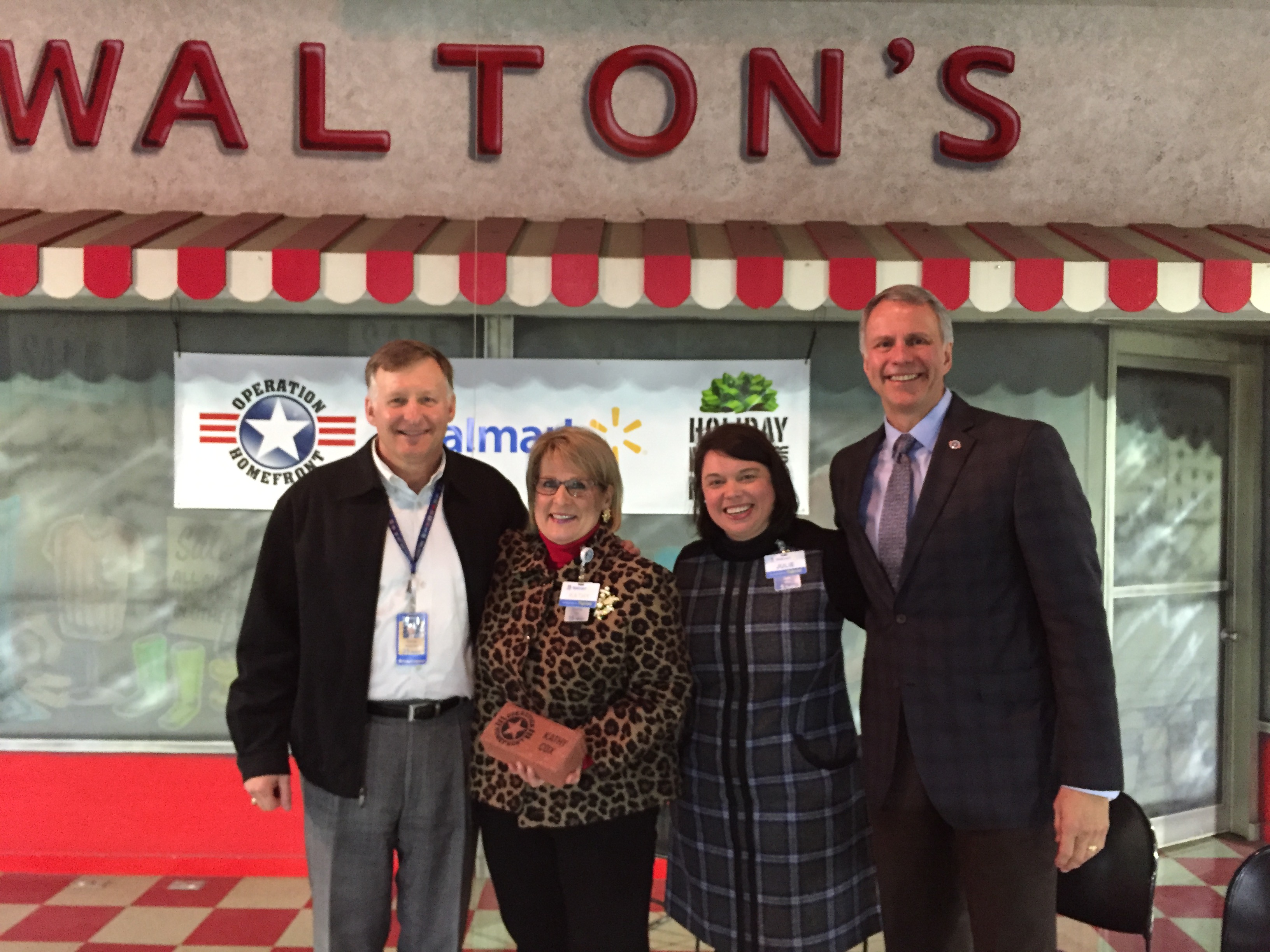 Kathy Cox, senior manager of the Walmart Foundation (second from left) receives the Operation Homefront Cornerstone Award for her contributions to the national nonprofit’s mission to build strong, sta