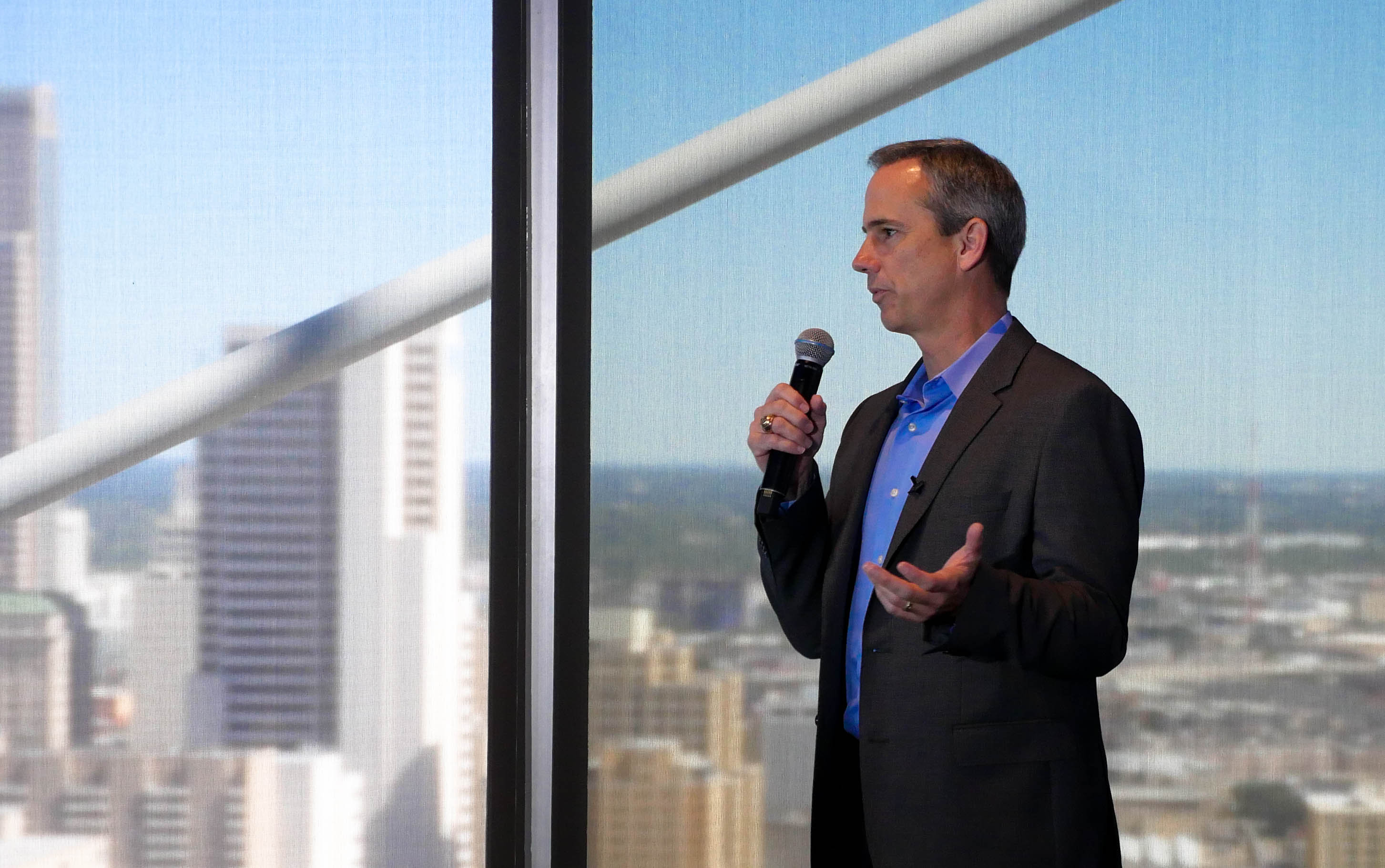 Sendero CEO Bret Farrar addresses employees at an all company off-site meeting