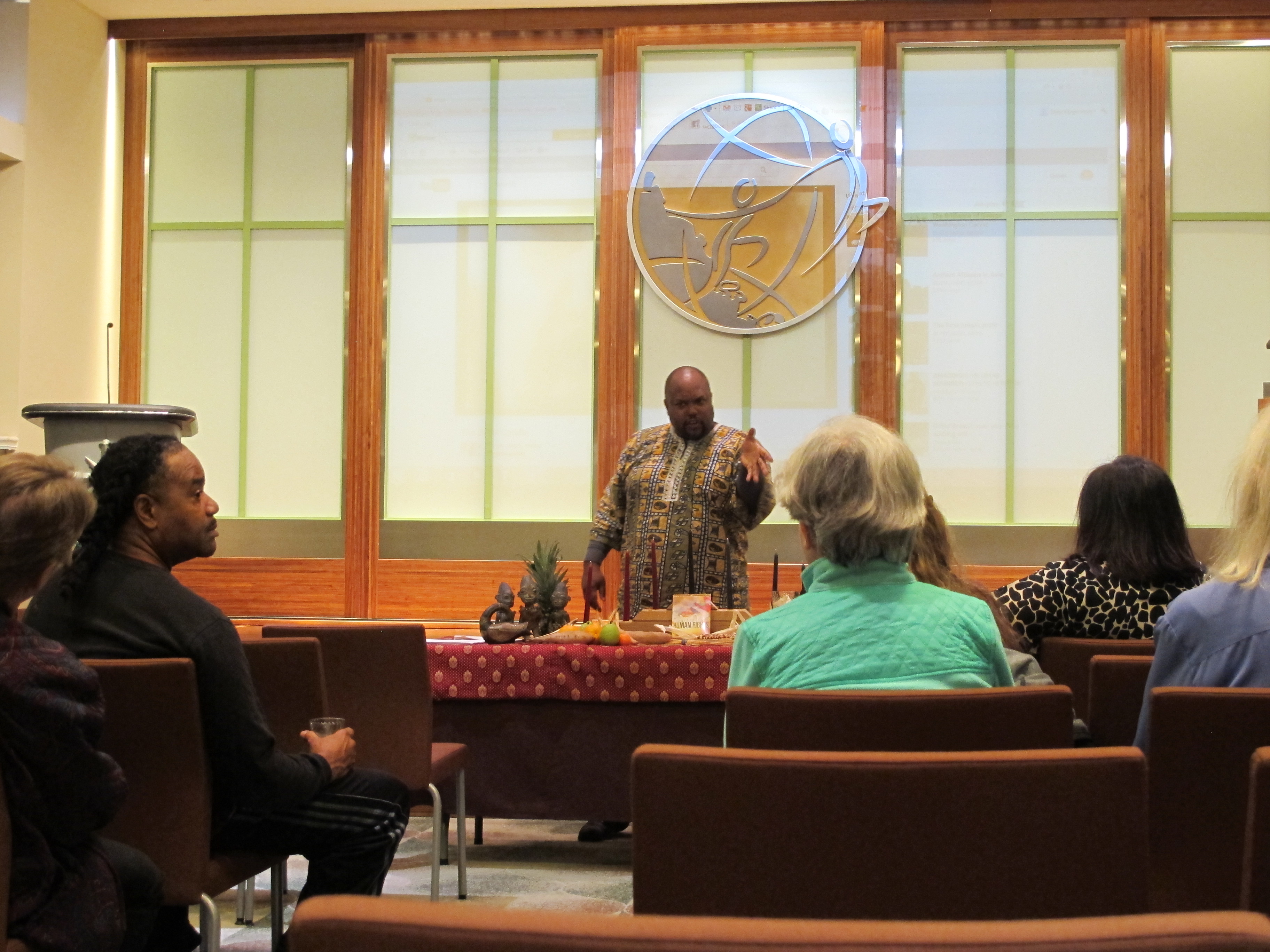 Local Coordinator of the Kwanzaa Michael Harris taught background information to the attendees.