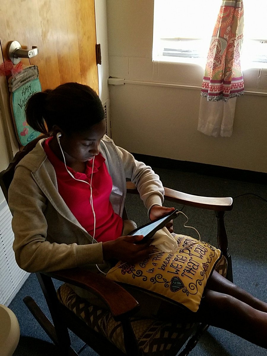5th grader takes in a book using the Learning Ally Link educational app.